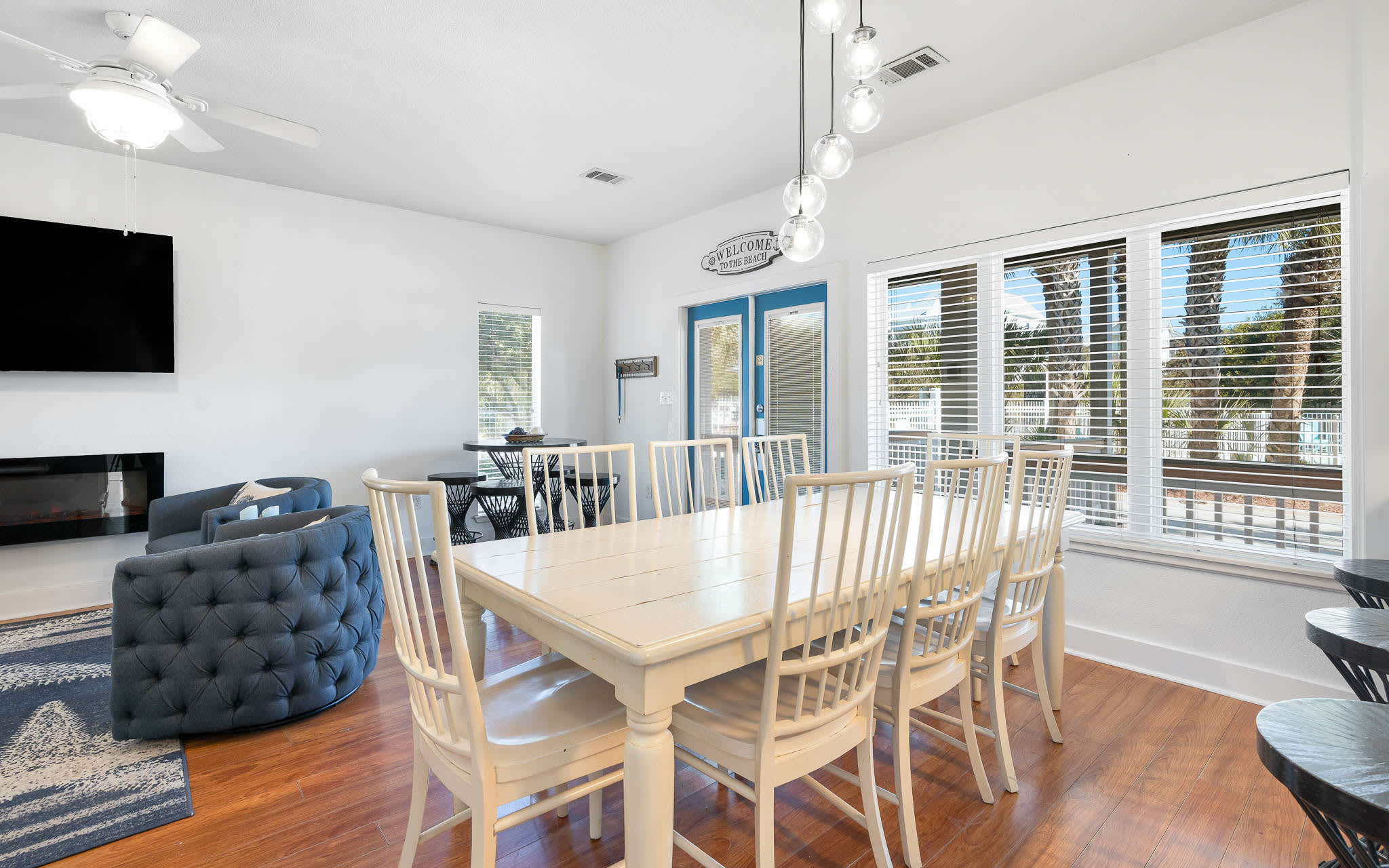 Gather your group around this spacious dining table for memorable meals, with natural light streaming through large windows.