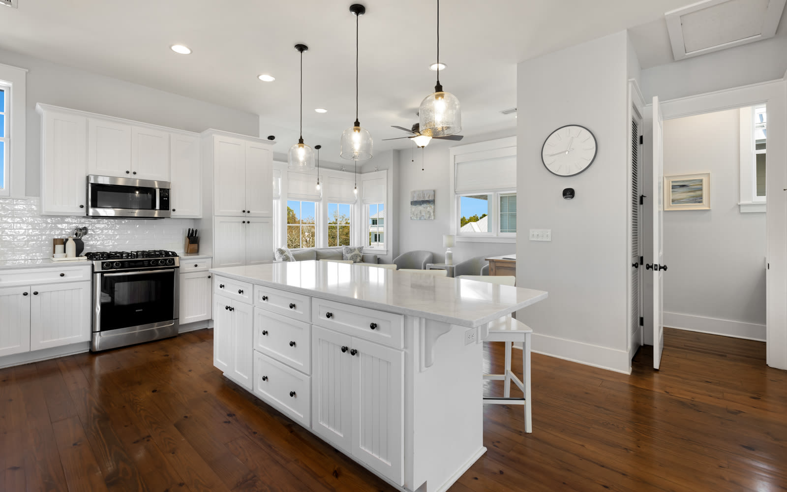Your bright modern kitchen features gleaming countertops, stylish pendant lighting, and everything you need to create memorable meals together.