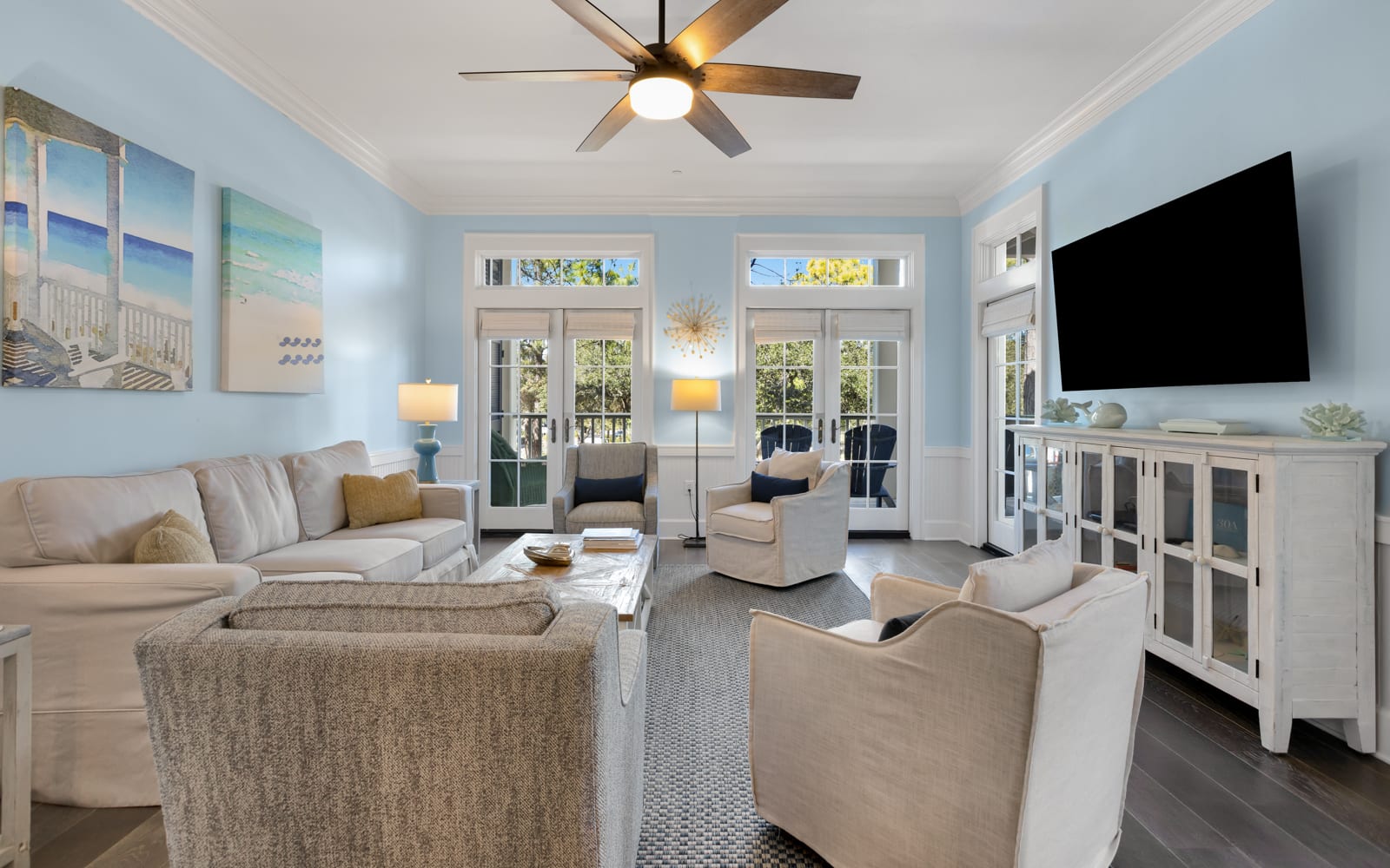 Settle into this bright, airy living room where coastal charm meets comfort. Plush seating and calming blues create your perfect relaxation retreat.