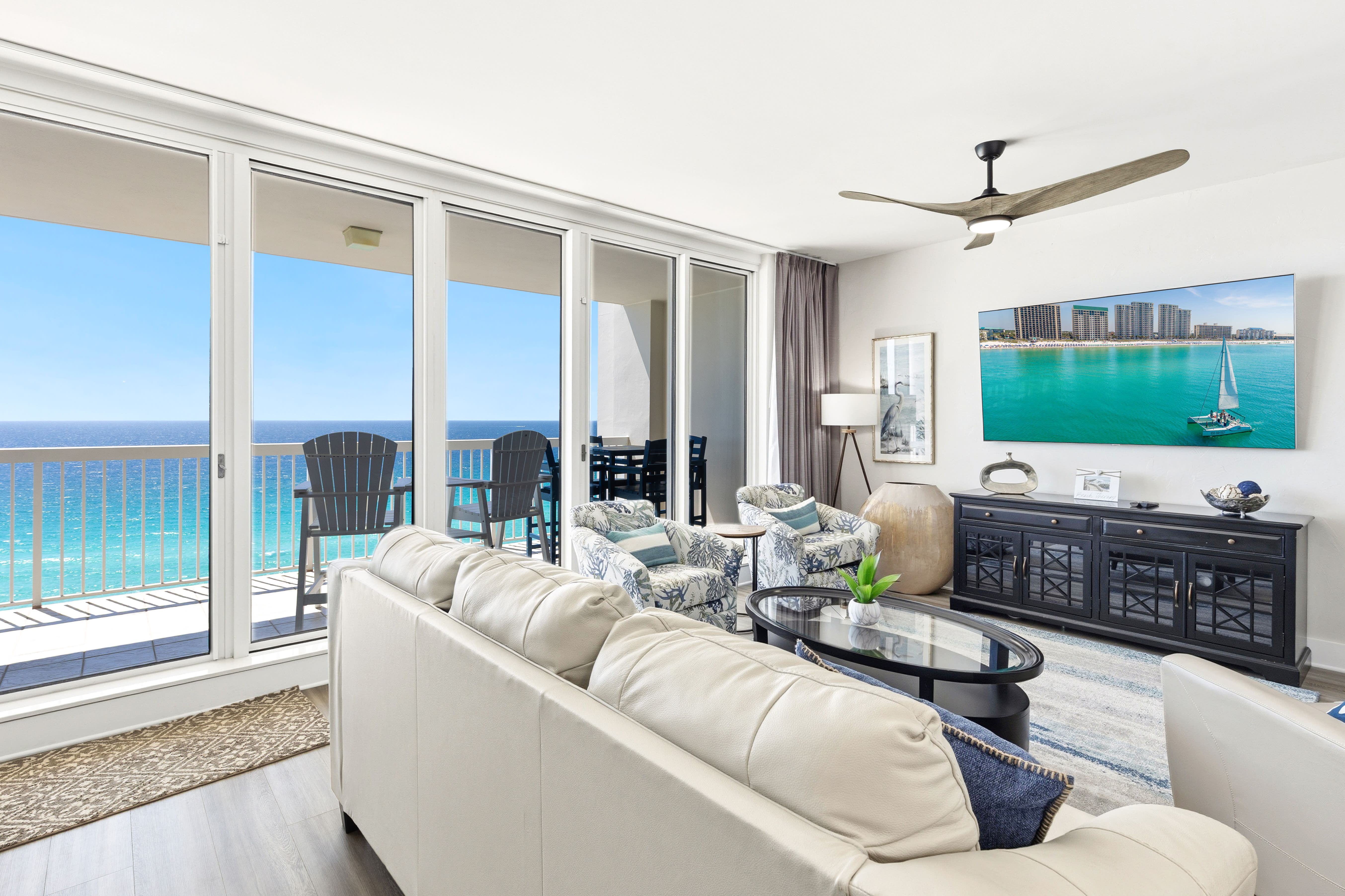 Unwind in your elegant oceanfront living room with stunning turquoise views stretching to the horizon.