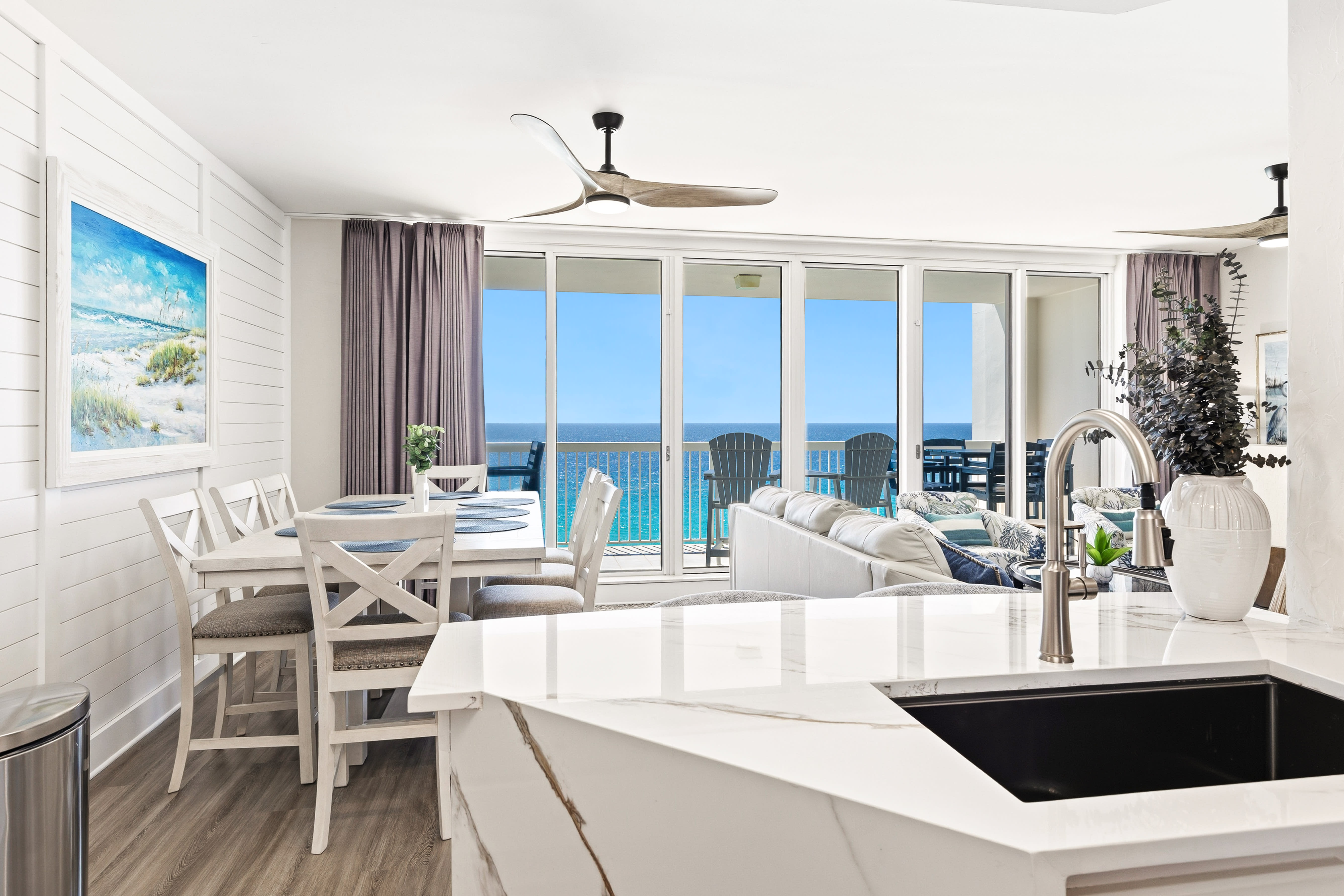 Step into your bright oceanfront sanctuary where every window frames endless turquoise waters and your morning coffee comes with breathtaking sea views.