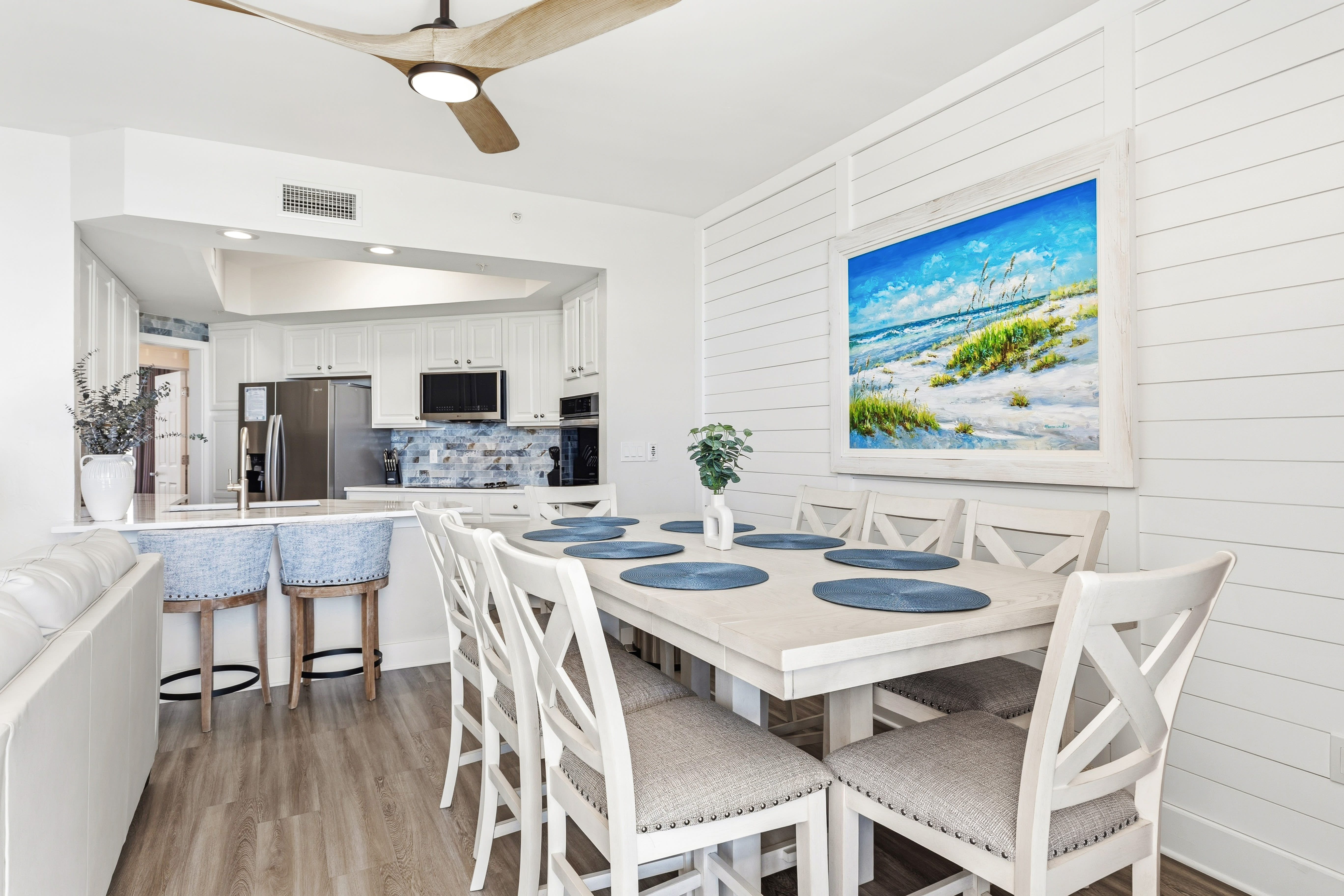 Your bright dining space flows seamlessly into the modern kitchen, perfect for morning coffee or family meals together.