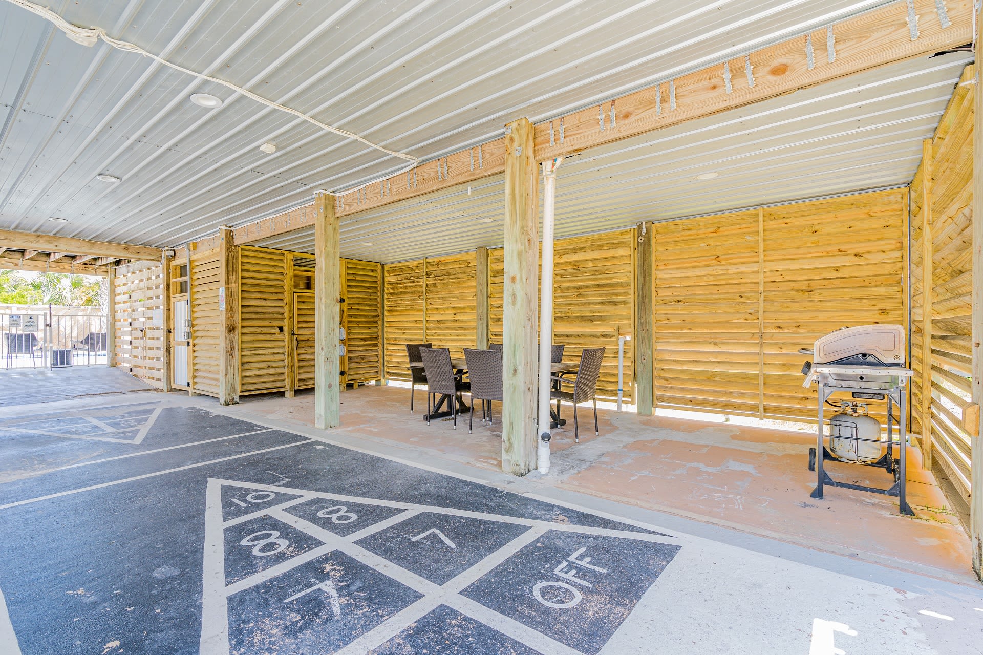 Blue Lagoon Shuffleboard + Covered Outdoor Table + Grill