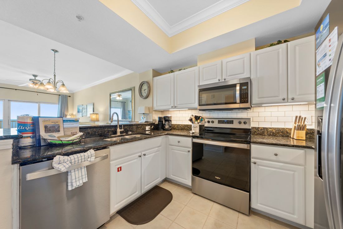 Your fully equipped kitchen awaits with granite counters, stainless appliances, and everything needed to create memorable meals during your stay.