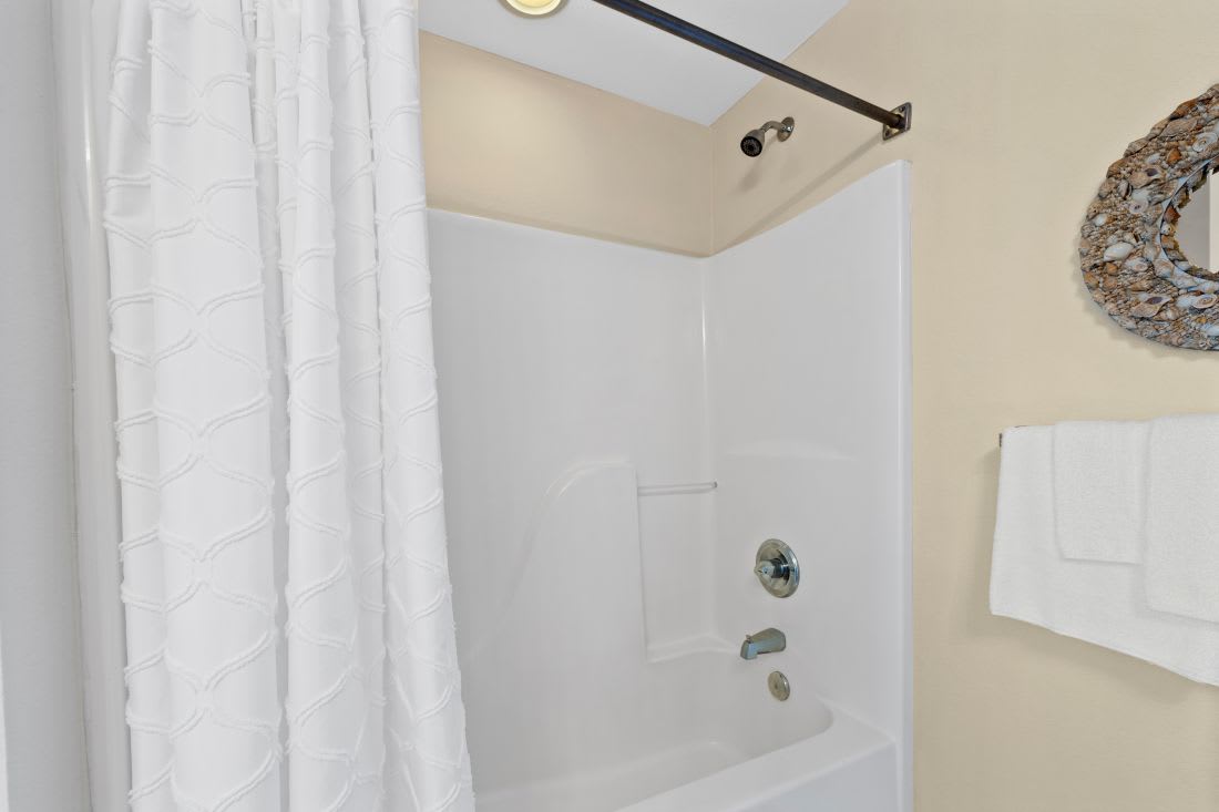Step into your private bathroom oasis with a pristine tub-shower combo, perfect for unwinding after your adventures.