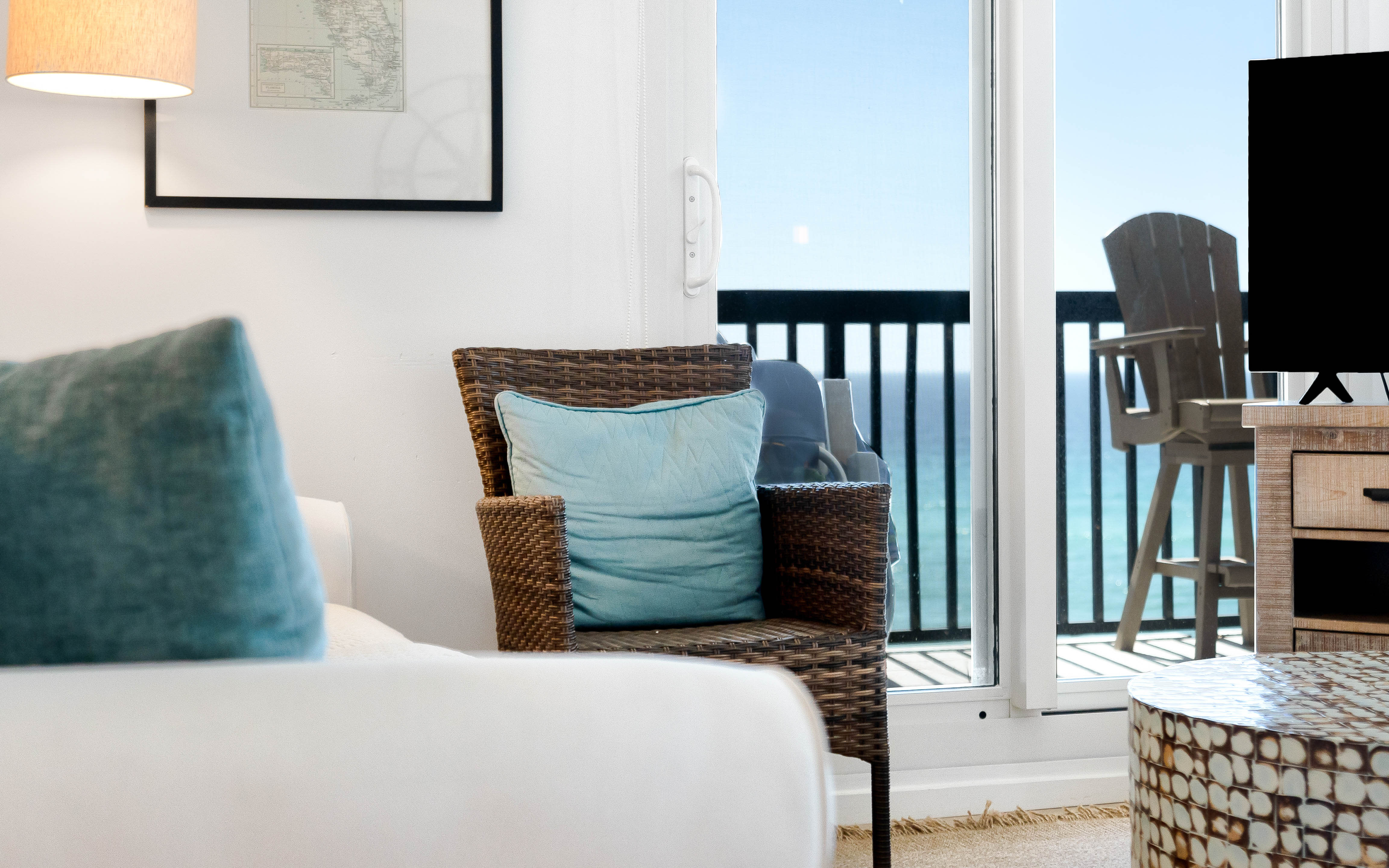Relax in your bright living space with coastal charm and step onto your private balcony for fresh ocean air.