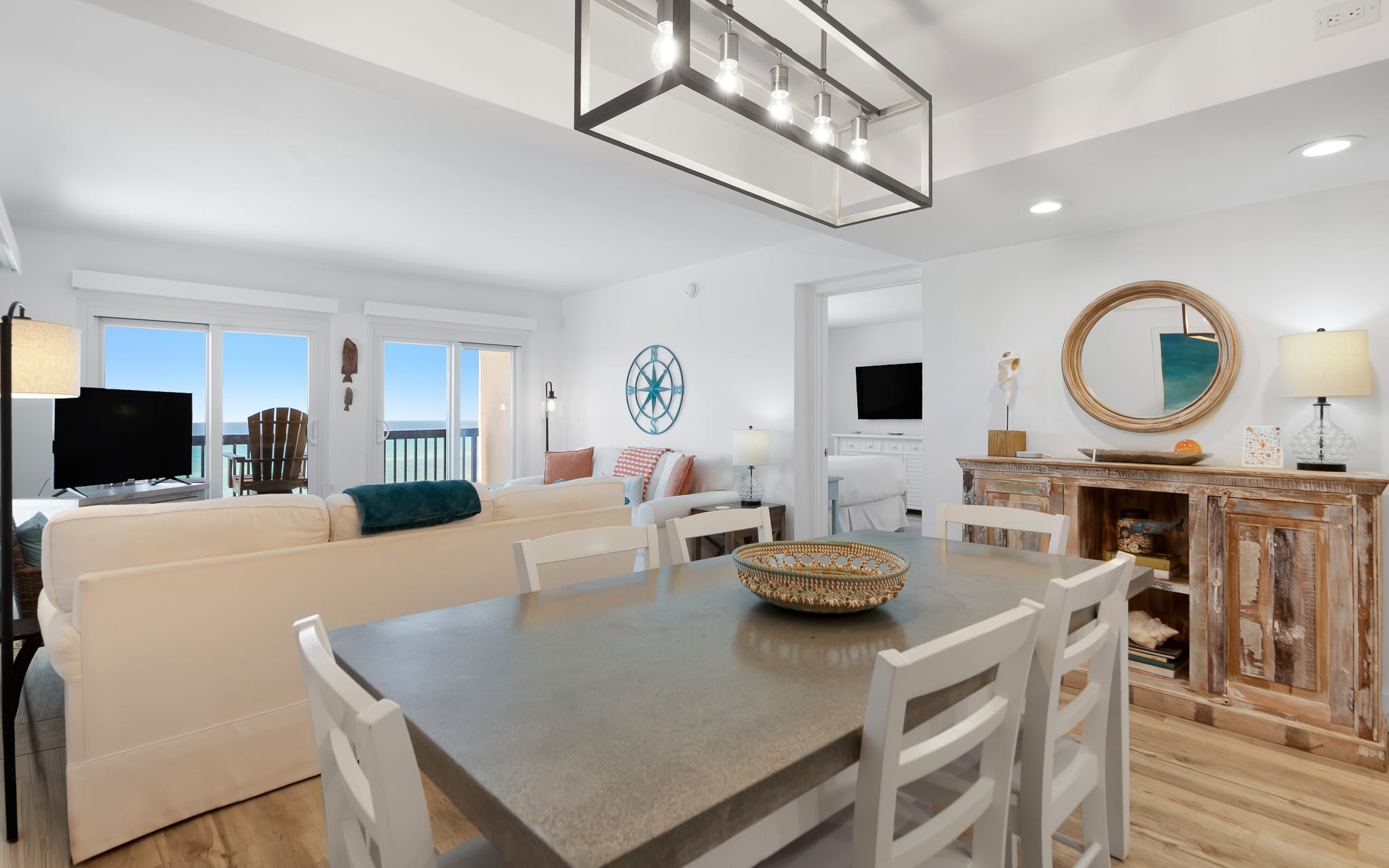 You'll love gathering around this spacious dining table while enjoying ocean views through the bright windows.