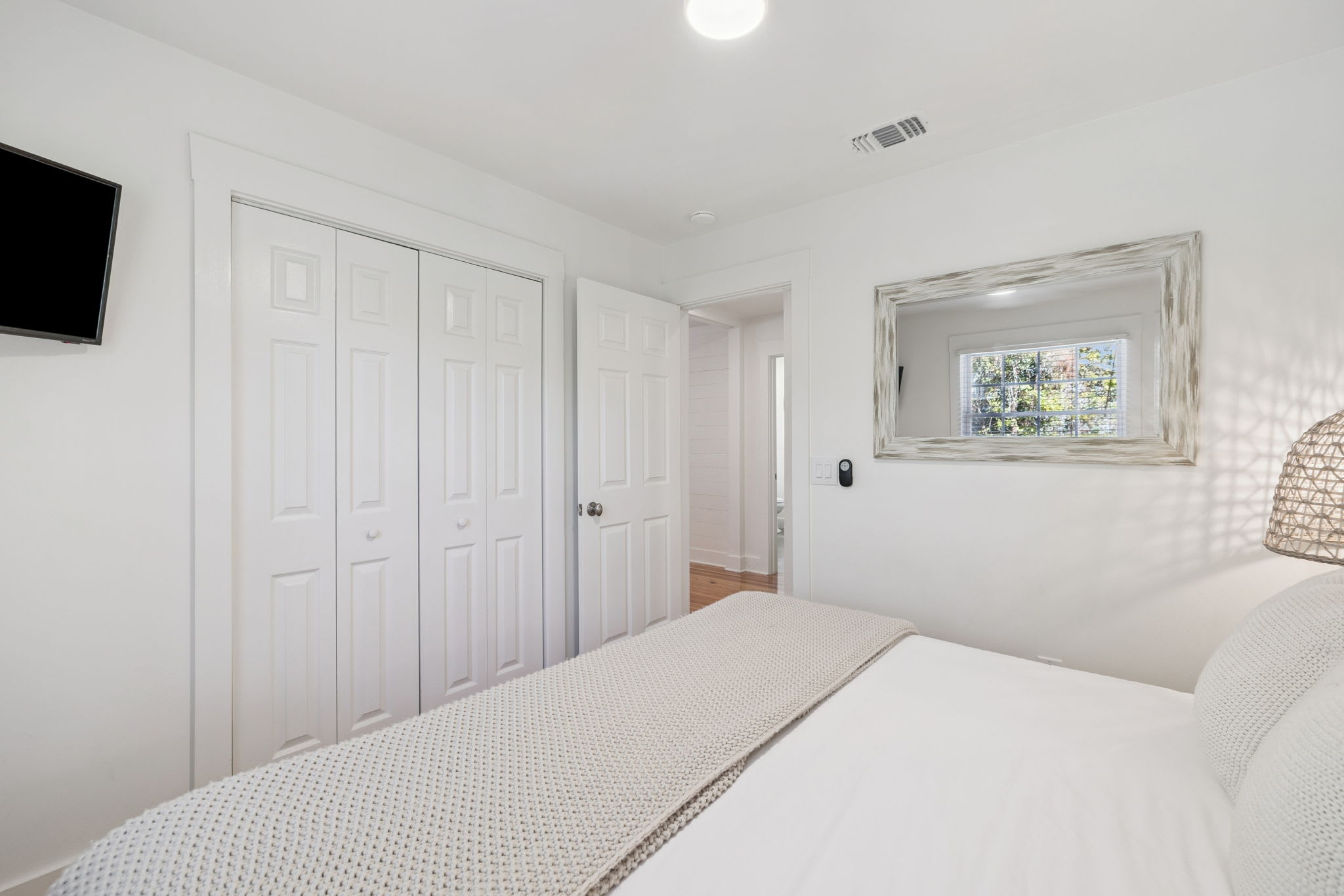 King Guest Suite - Offering Ample Storage + Flat-Screen TV