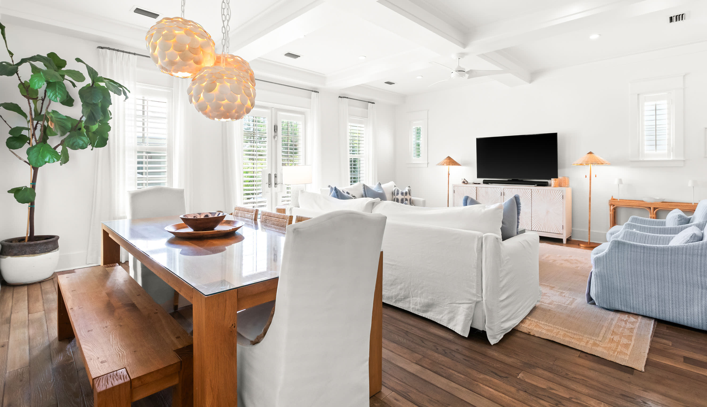 The living area flows through the French doors to your private resort