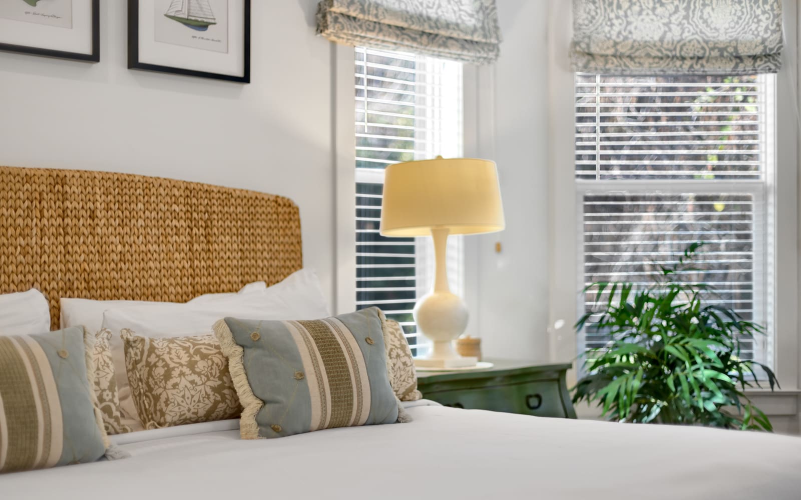 Unwind in this coastal-inspired bedroom with natural textures, soft linens, and gentle morning light filtering through plantation shutters.