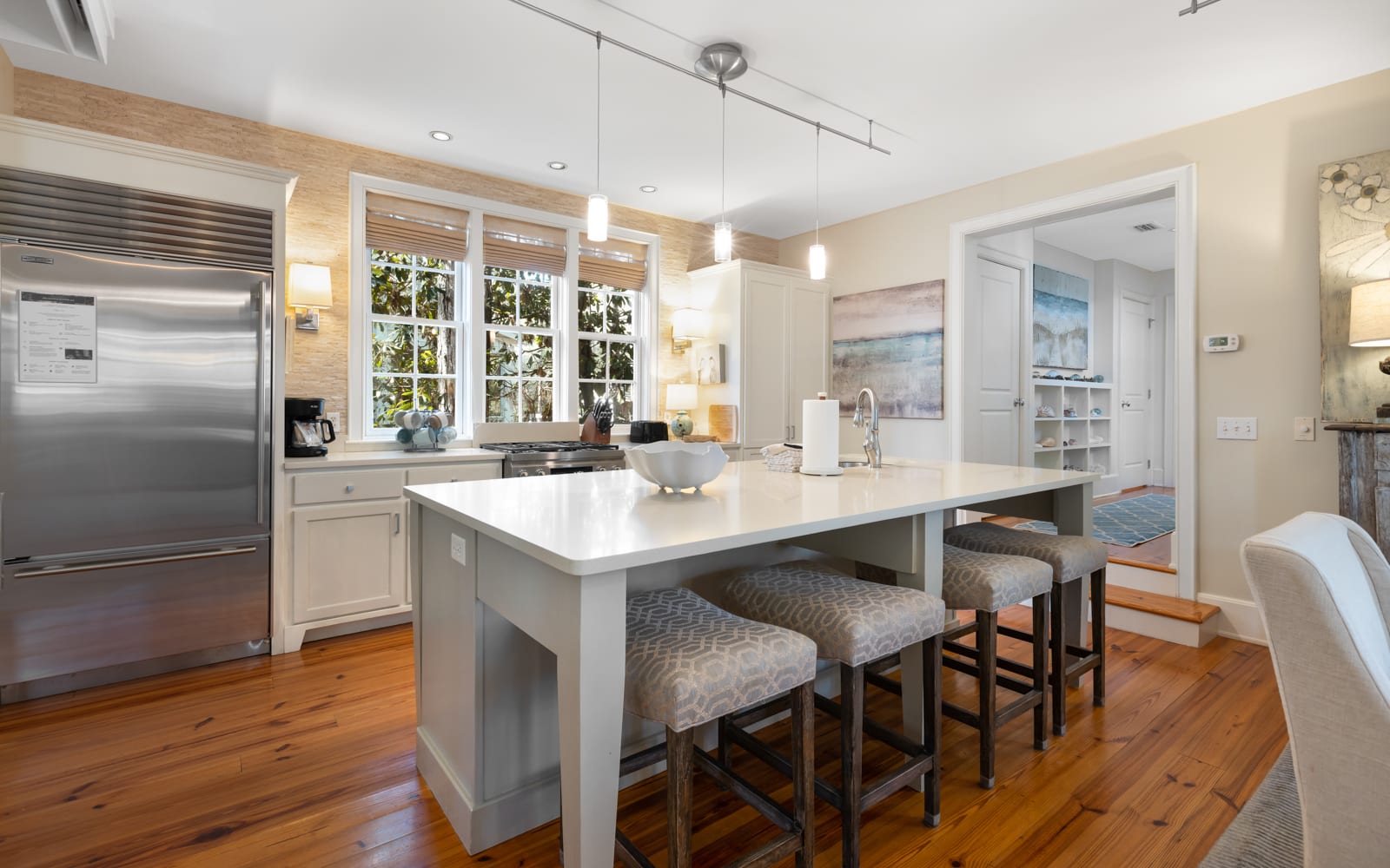 Step into your dream kitchen with gleaming countertops, stainless appliances, and a breakfast bar perfect for morning coffee or evening wine.