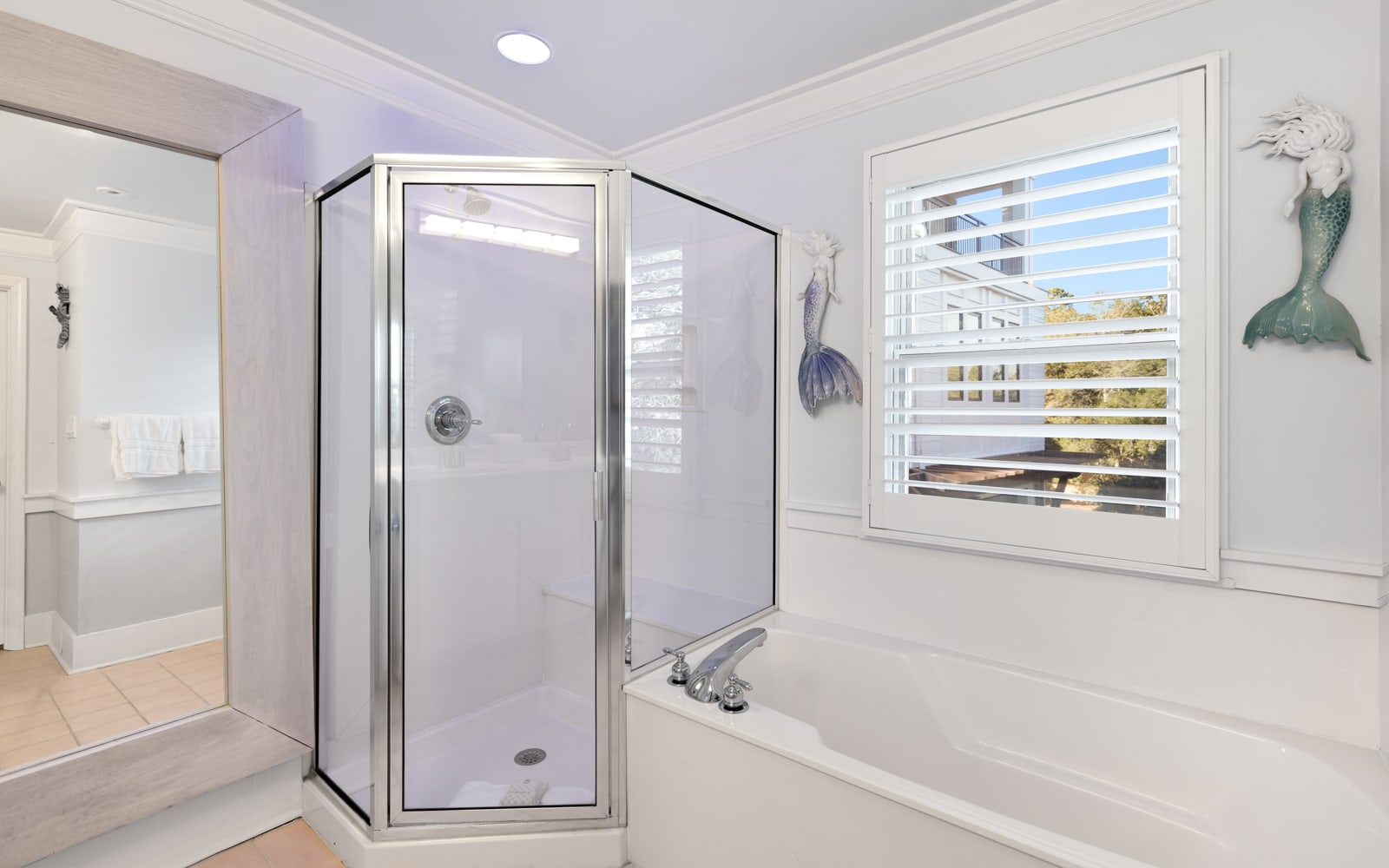 Unwind in your elegant master bathroom with a luxurious soaking tub and separate glass shower.