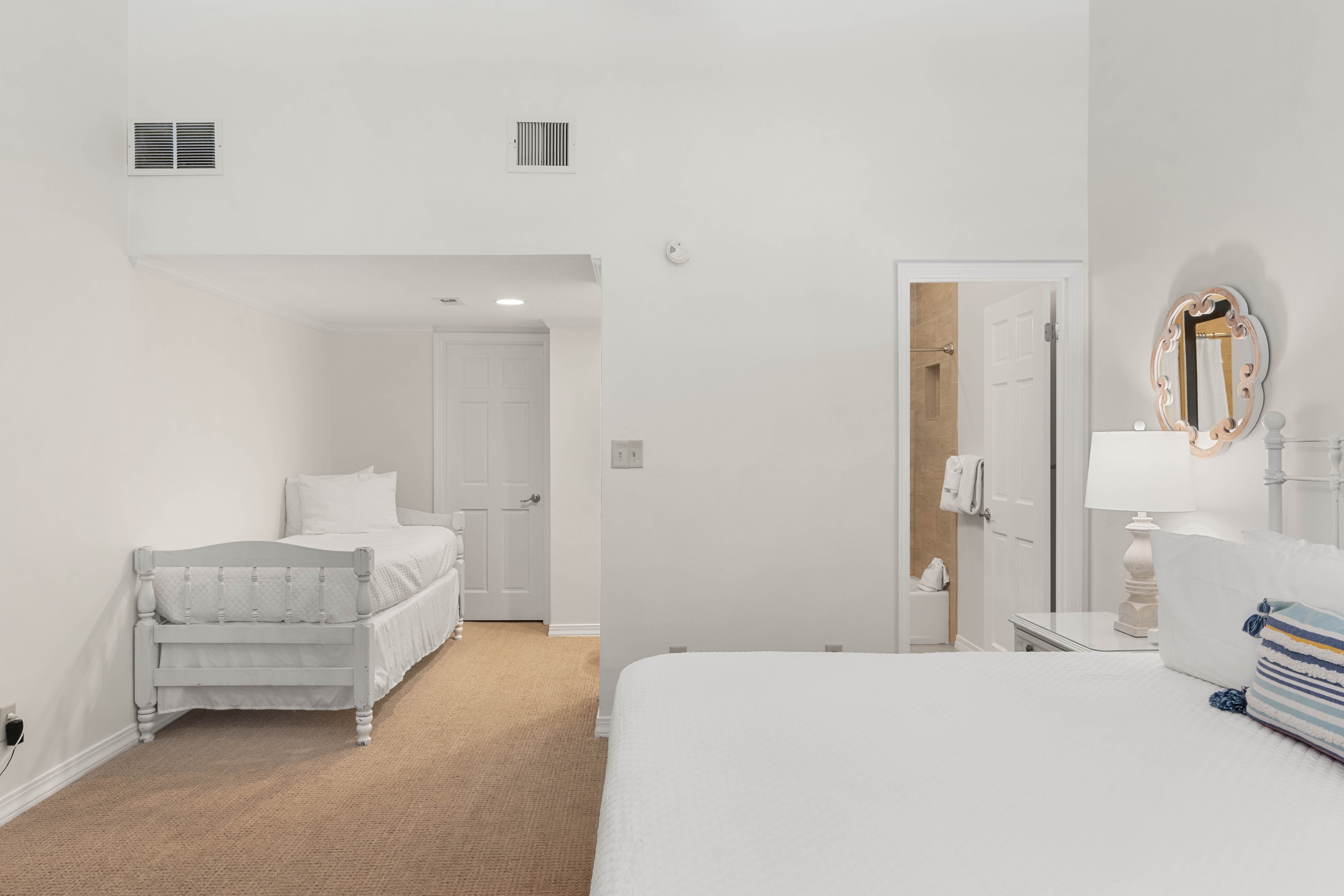 Settle into your peaceful bedroom suite with a cozy crib for little ones and elegant vanity area—comfort meets convenience.