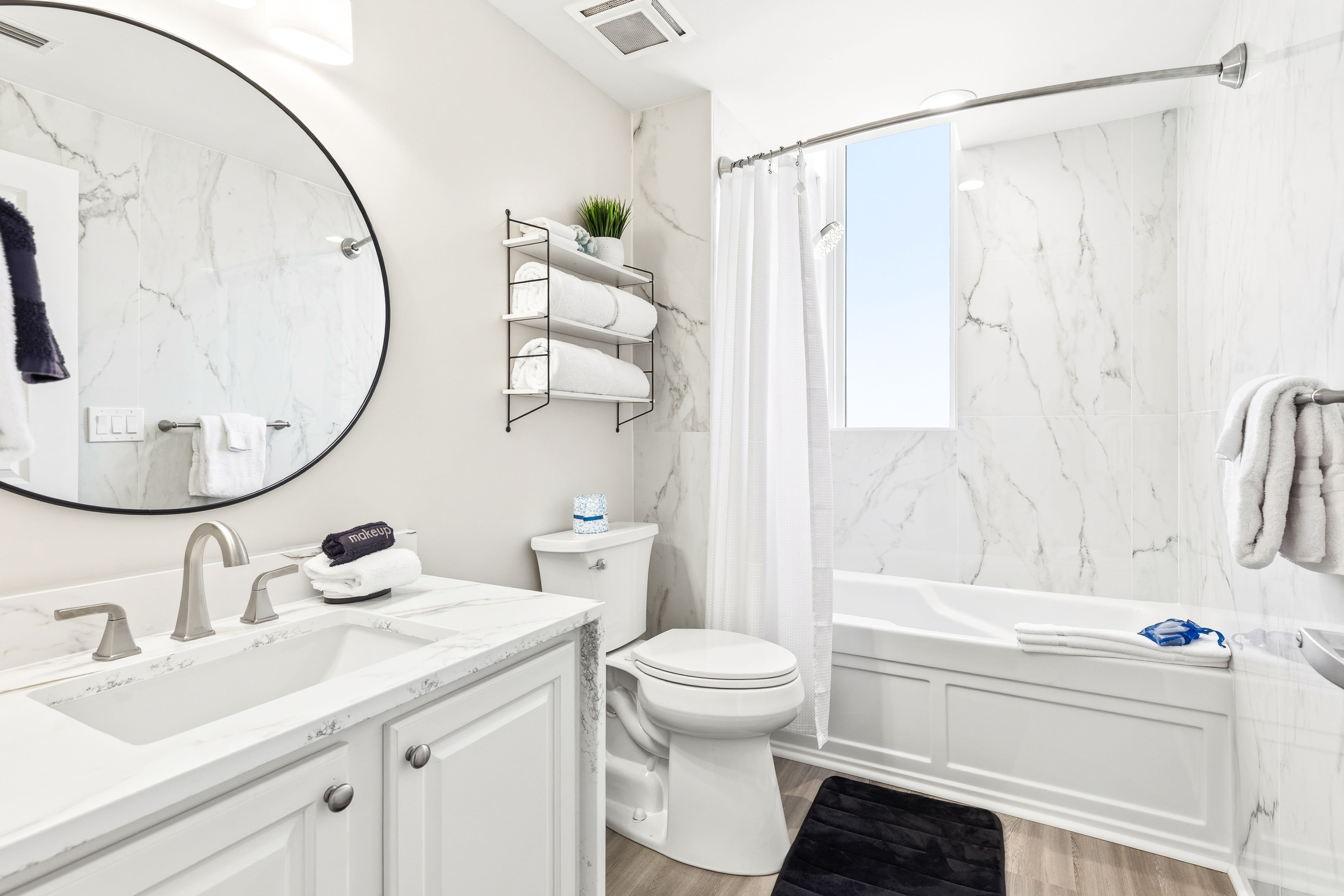 Unwind in your marble-appointed bathroom with luxurious soaking tub and modern amenities.