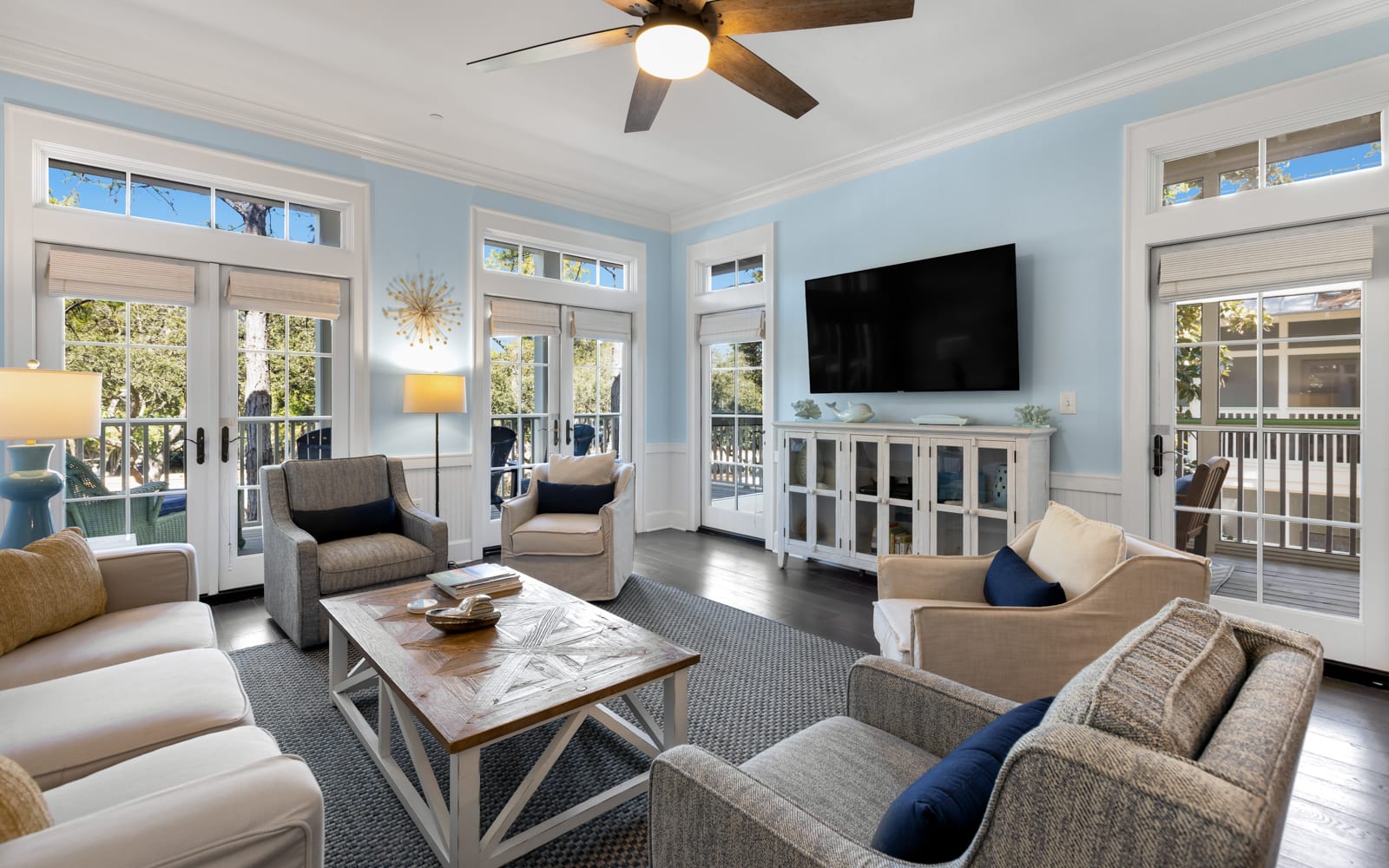 Unwind in your bright, airy living room with French doors opening to private balconies and comfortable seating for memorable moments.