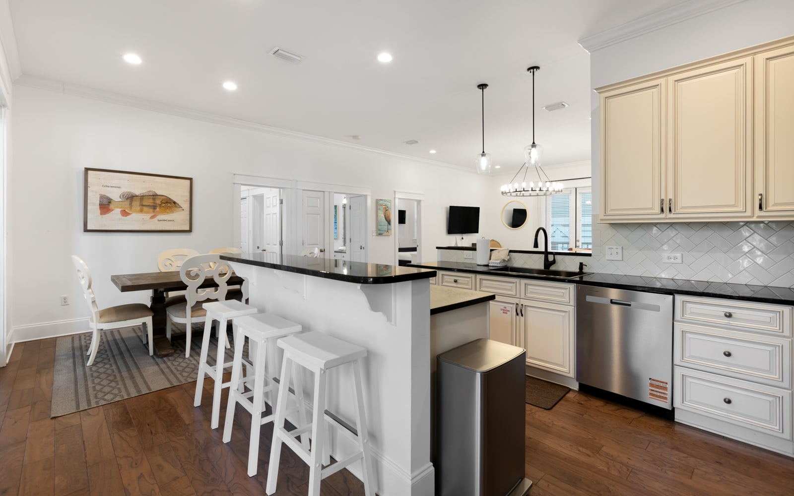 Your gourmet kitchen features pristine countertops, modern appliances, and a welcoming breakfast bar where you'll enjoy morning coffee.