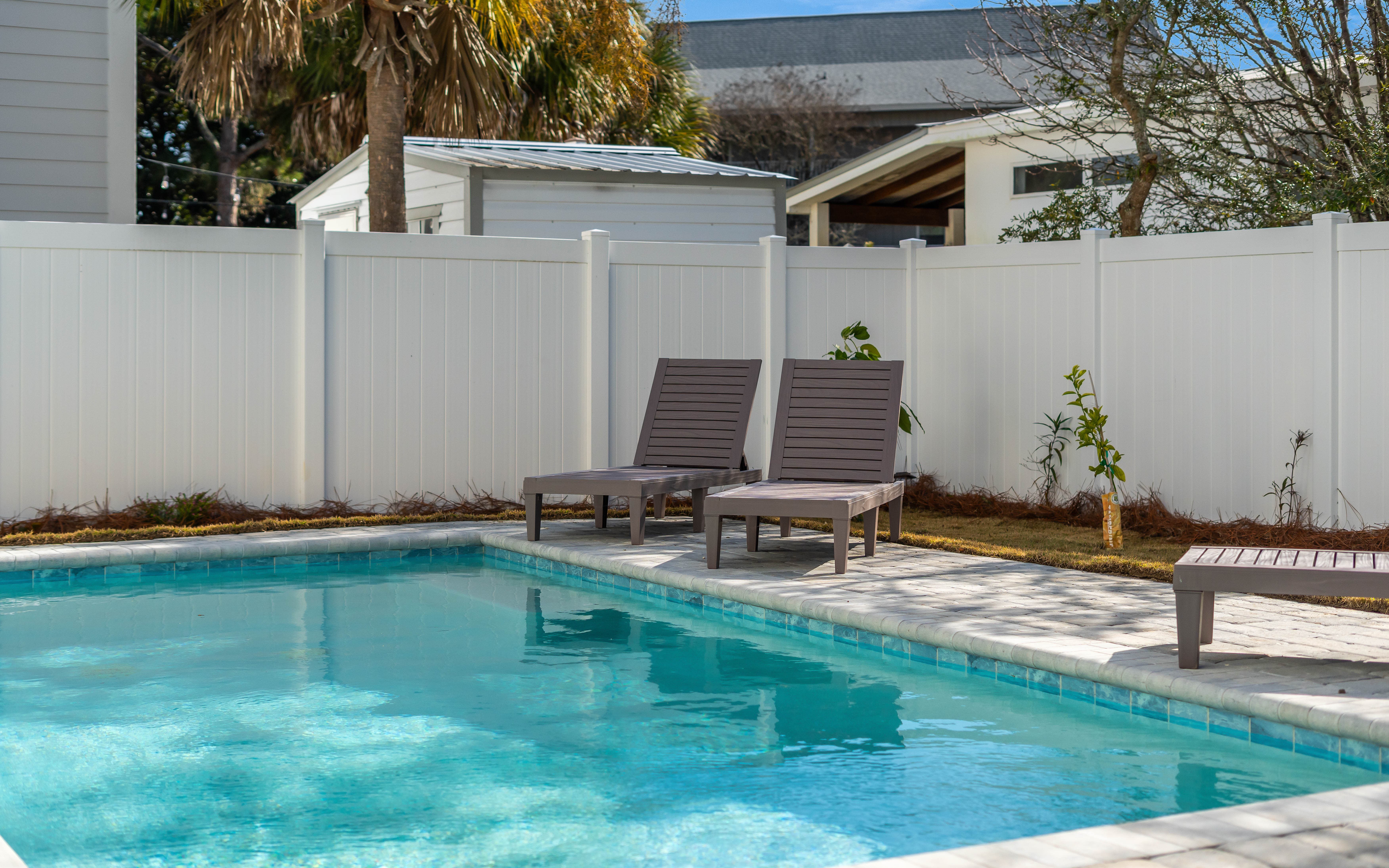Soak up sunshine on your private poolside loungers, surrounded by tropical palms and complete privacy.