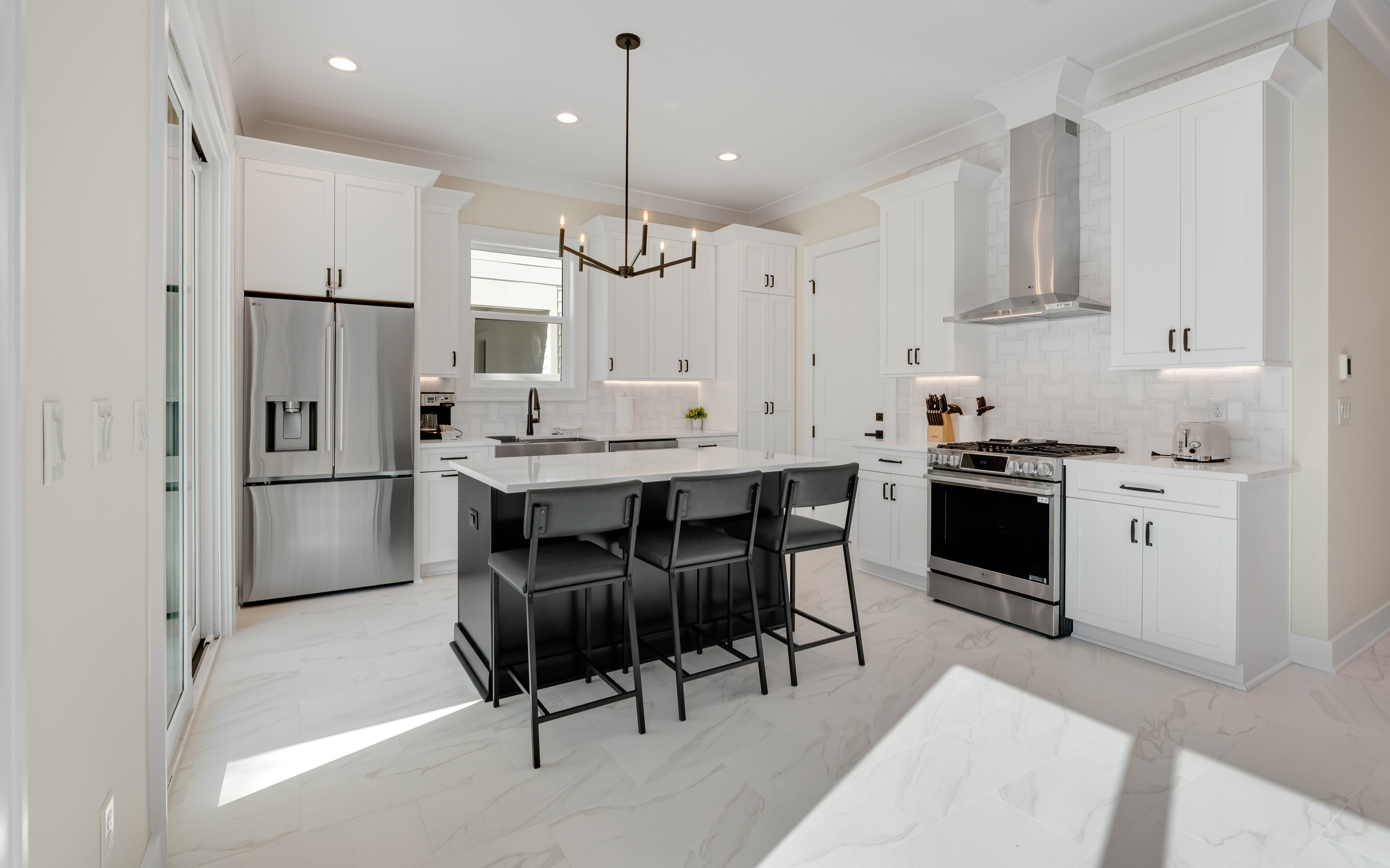 Step into your gourmet kitchen where crisp white cabinets and sleek countertops create the perfect space for culinary adventures and morning coffee moments.