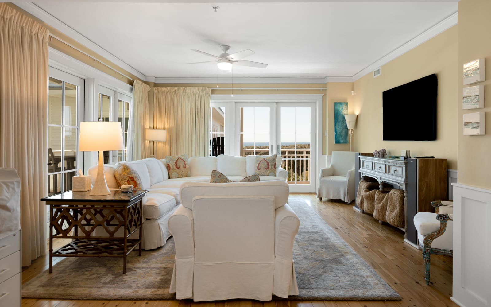 Settle into this elegant living room where plush white seating surrounds a chic coffee table, perfect for your morning coffee or evening conversations.