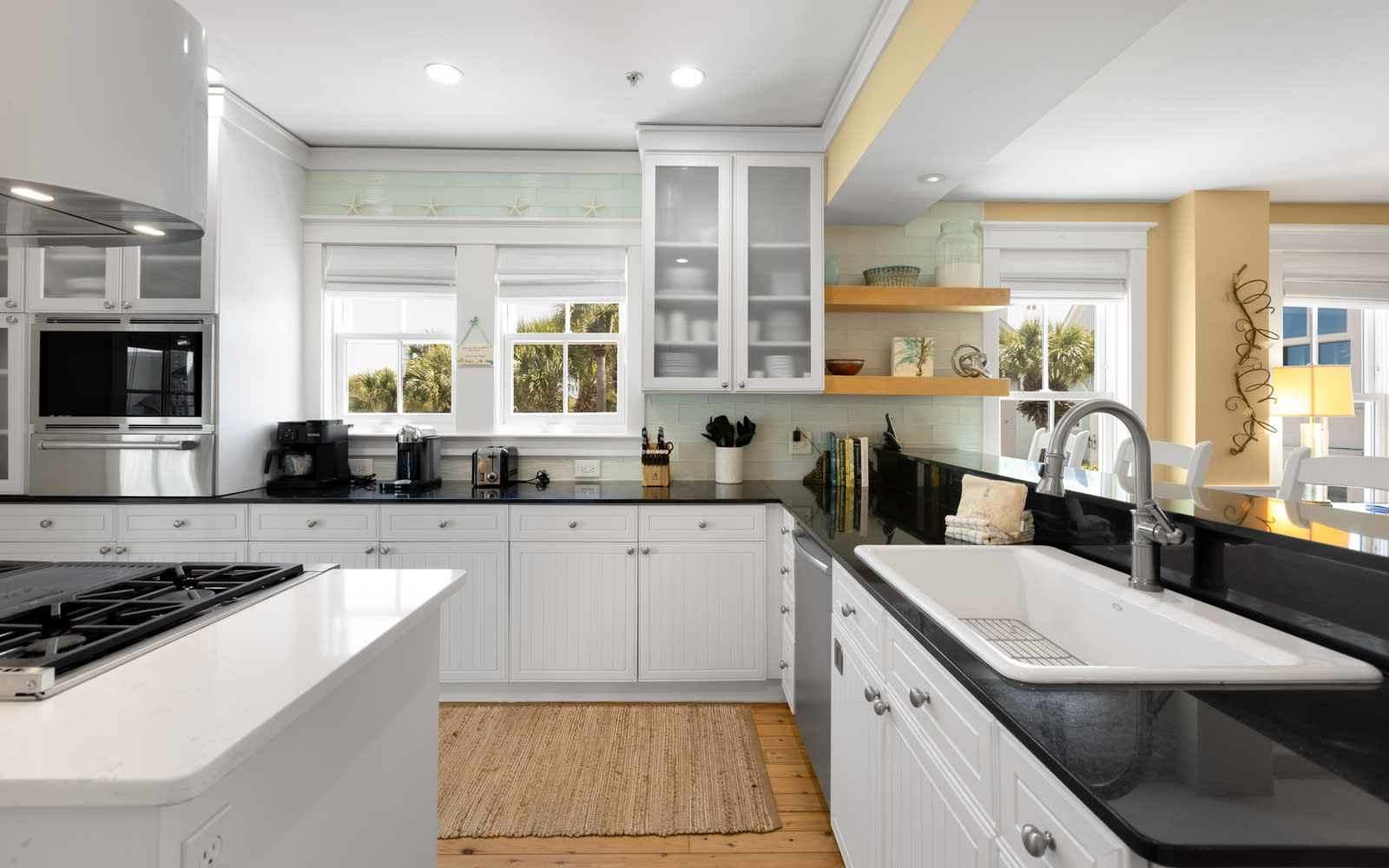 Your spacious gourmet kitchen invites culinary adventures with sleek granite counters, stainless appliances, and warm natural light streaming through pristine windows.