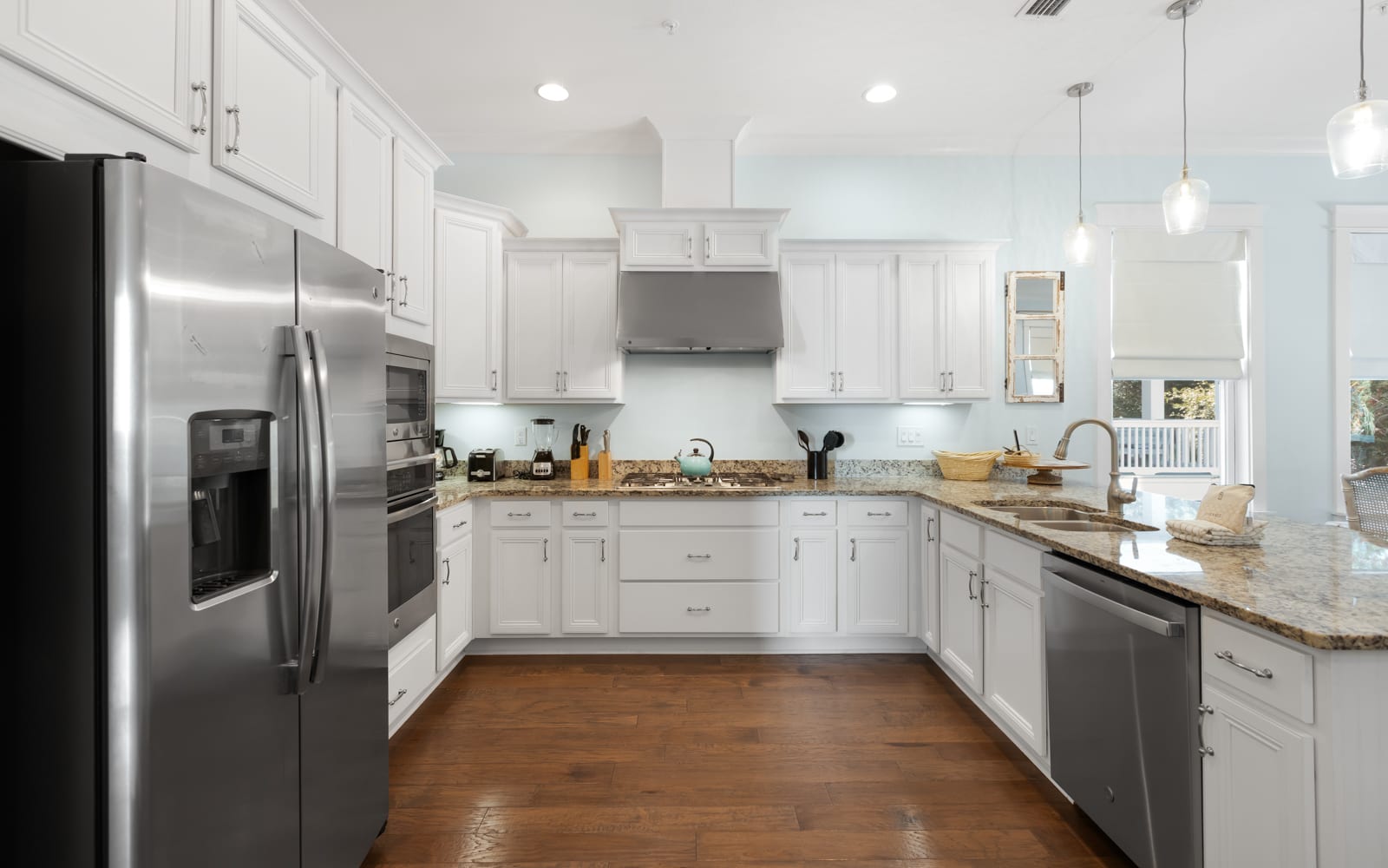 Your gourmet kitchen awaits with gleaming granite counters, stainless steel appliances, and all the space you need to create memorable meals together.