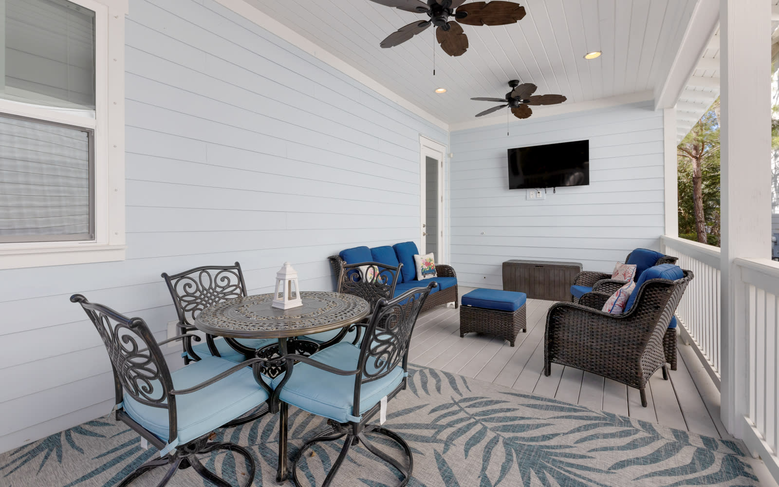 Relax on your private covered porch with comfy seating, ceiling fans, and entertainment—perfect for morning coffee or evening unwinding.