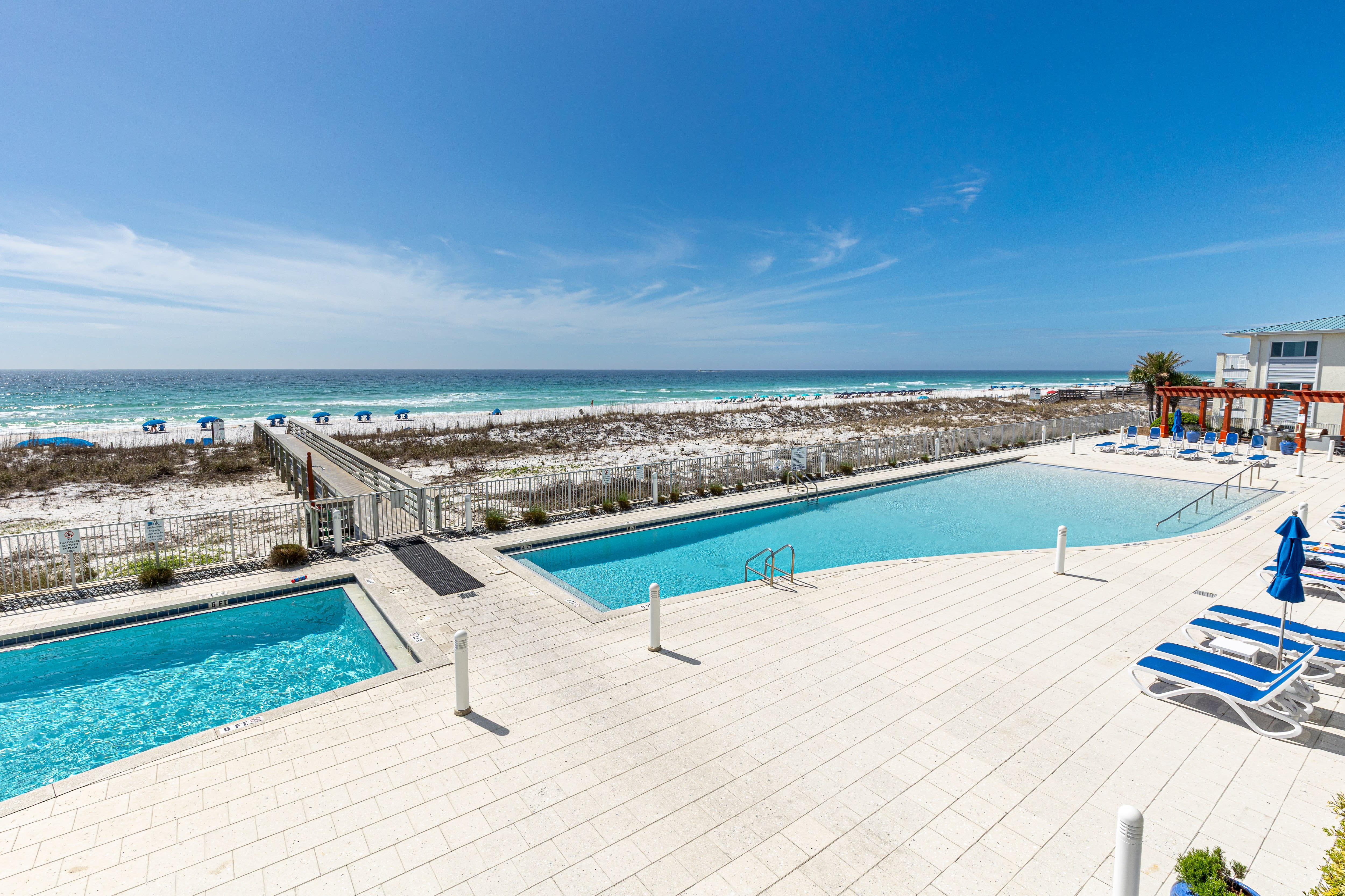 Beachfront pools with direct access to pristine white sand and emerald waters create the perfect coastal retreat.