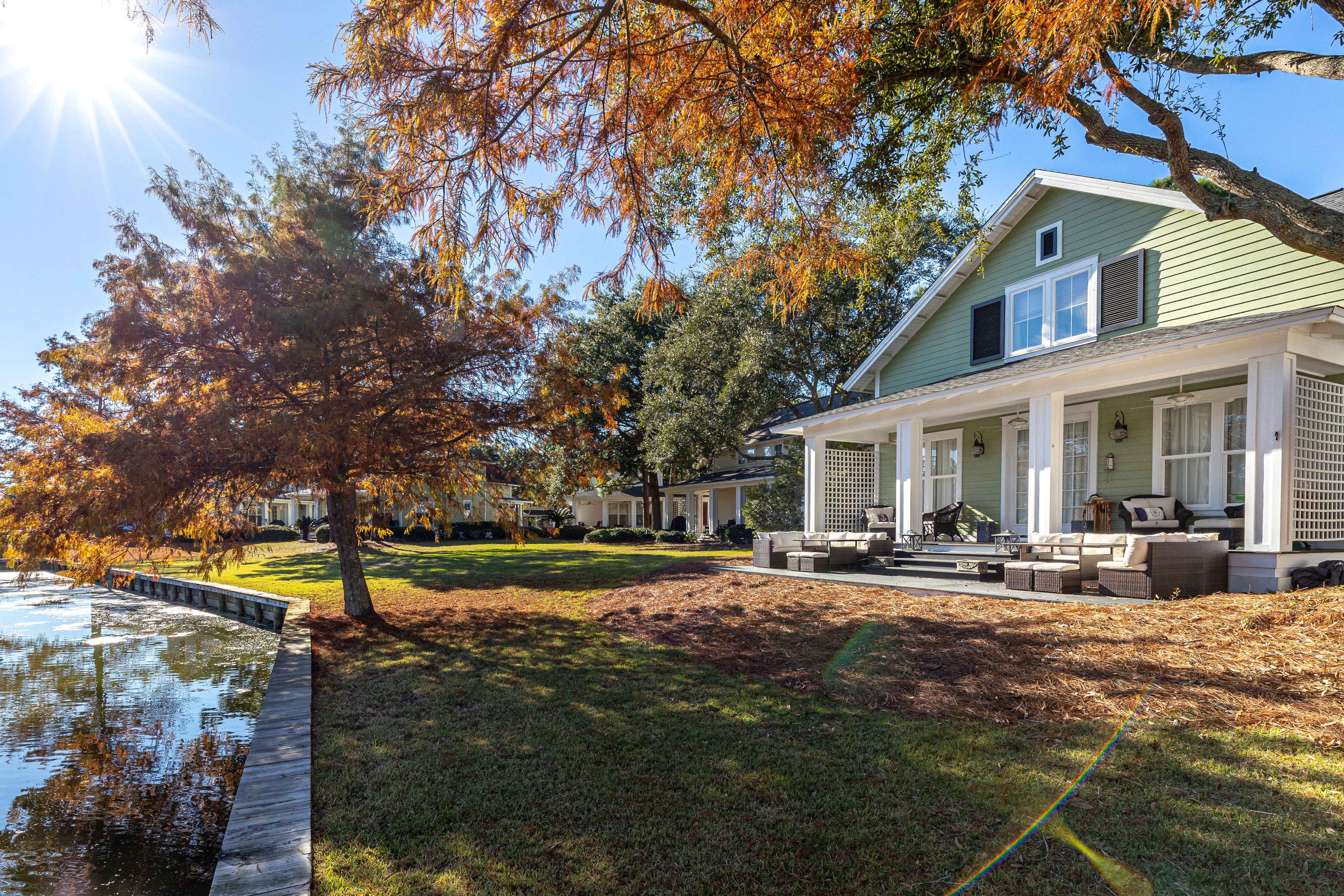 Waterfront property with autumn foliage and spacious outdoor areas perfect for seasonal retreats.
