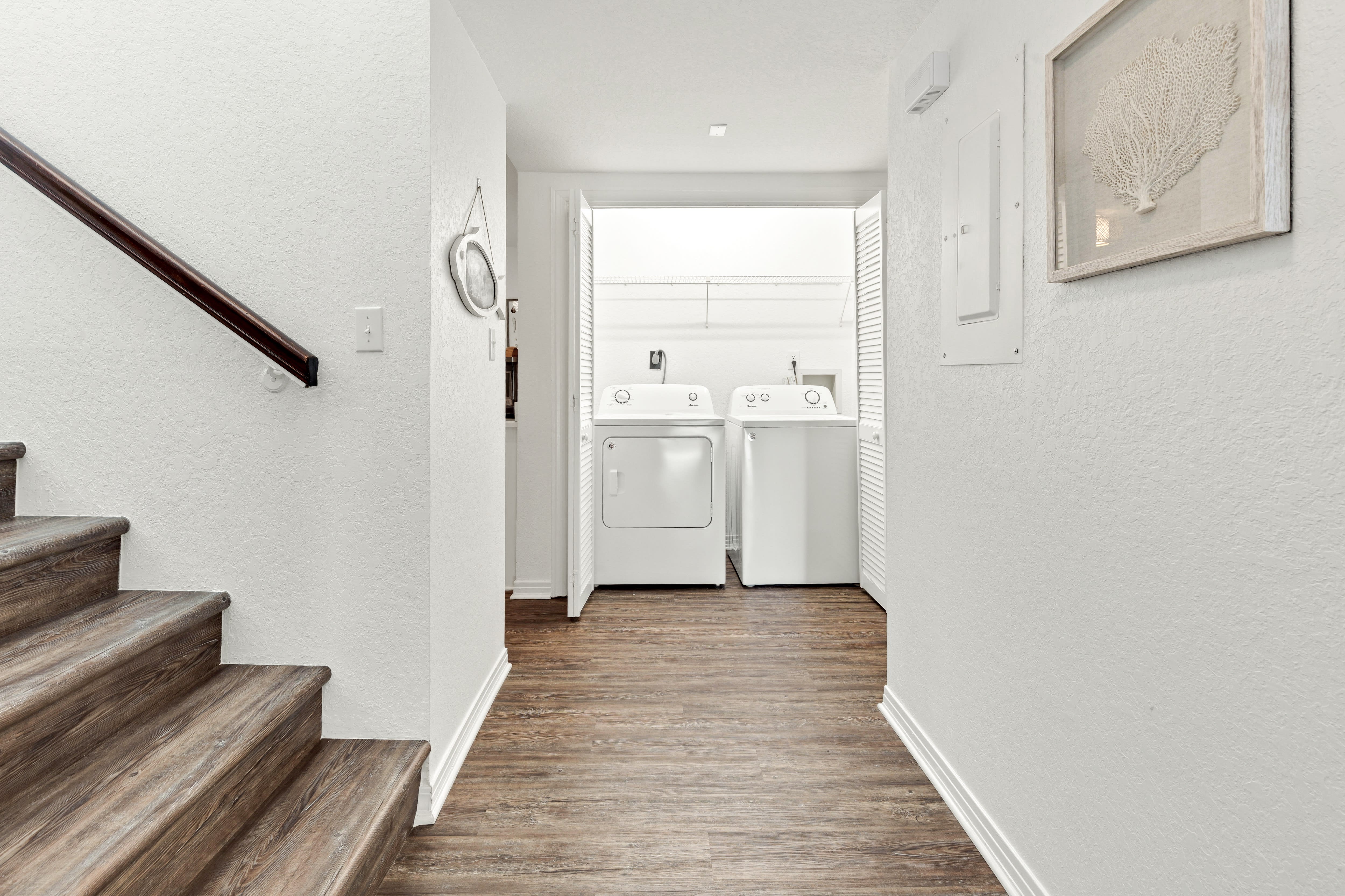 Your own dedicated laundry space keeps your vacation wardrobe fresh with full-sized washer and dryer tucked away in this bright, clean alcove.