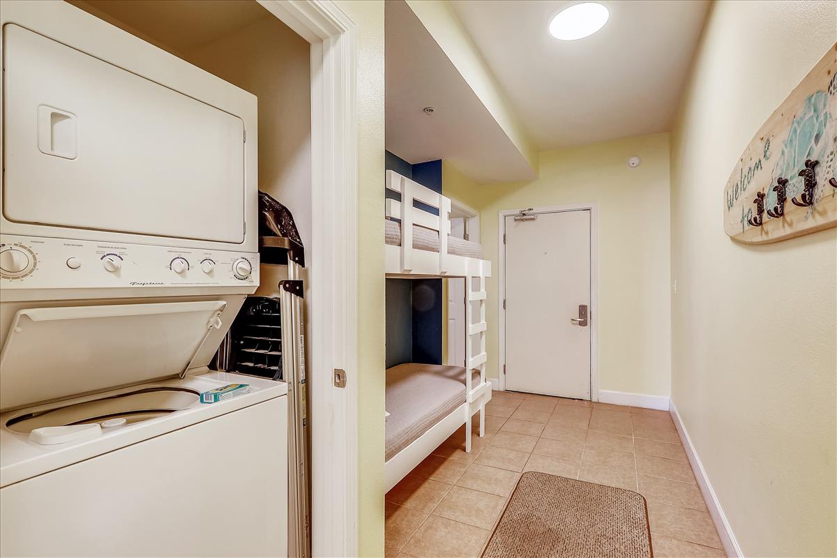 Hall houses bunk area and W/D closet