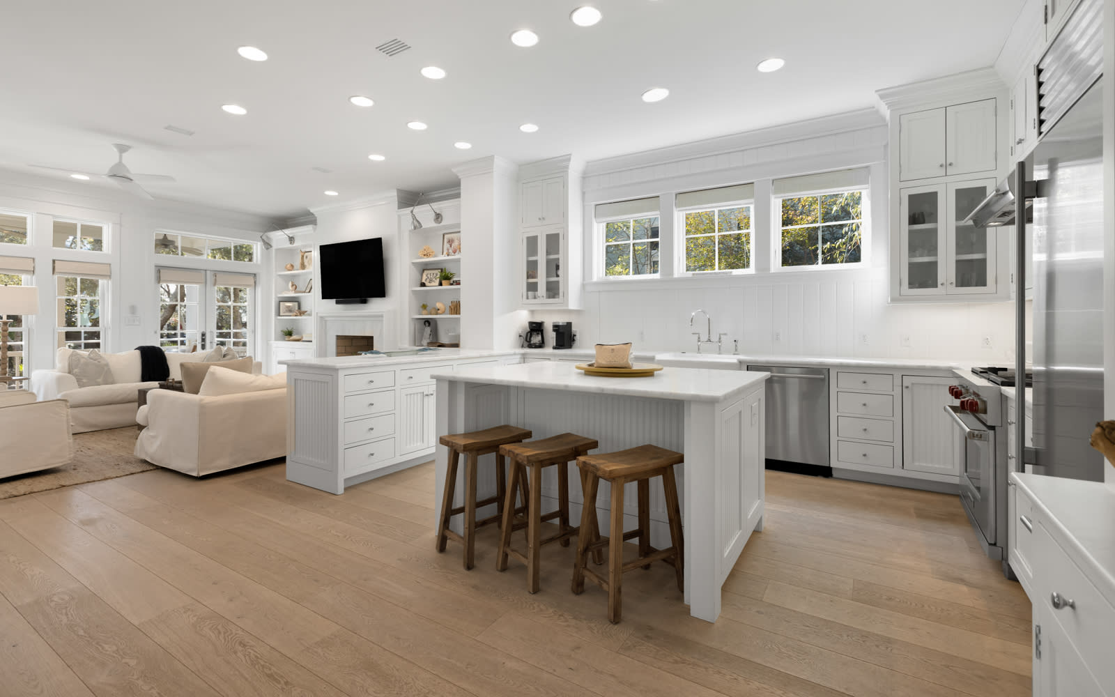 Your bright, open-plan kitchen flows seamlessly into the living area, creating perfect spaces for cooking, dining, and relaxing together.