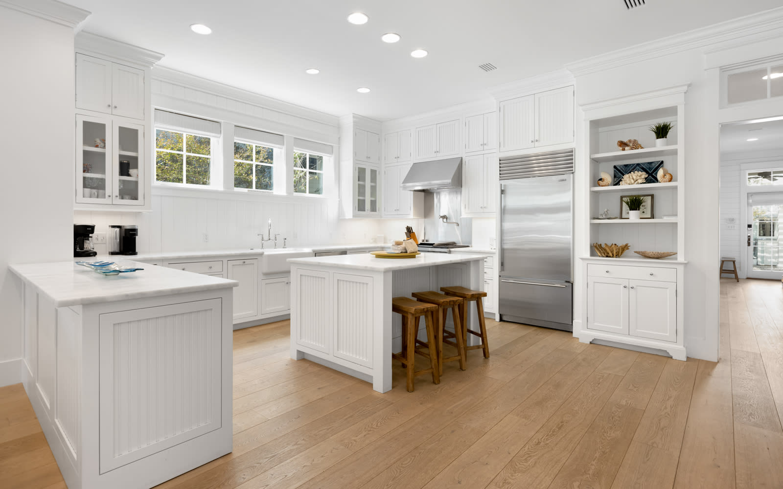 Cook together in this bright, spacious kitchen with premium appliances and a welcoming island perfect for morning coffee or evening meals.