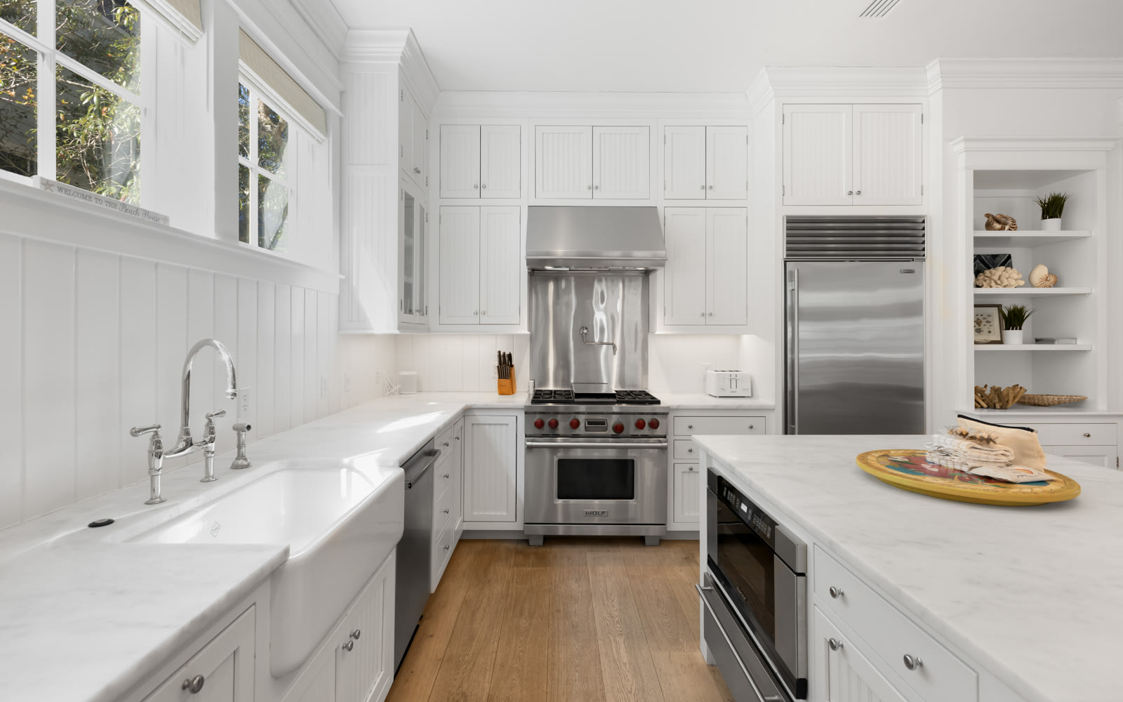 This bright kitchen welcomes you with crisp white cabinets, premium appliances, and plenty of counter space for your culinary adventures.