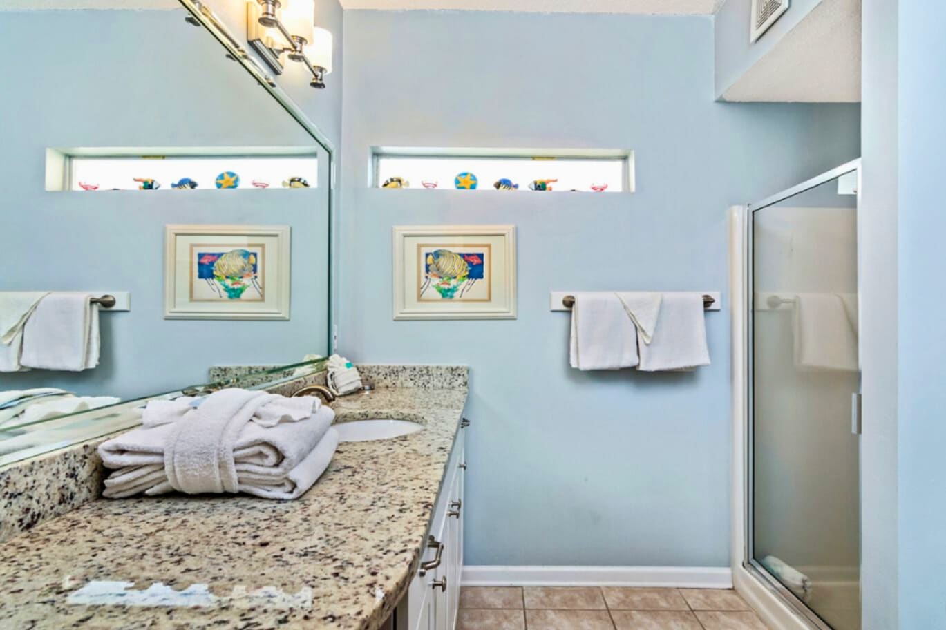 Refresh in your serene bathroom with granite counters, soft towels, and coastal-themed touches that make your morning routine feel like a spa escape.