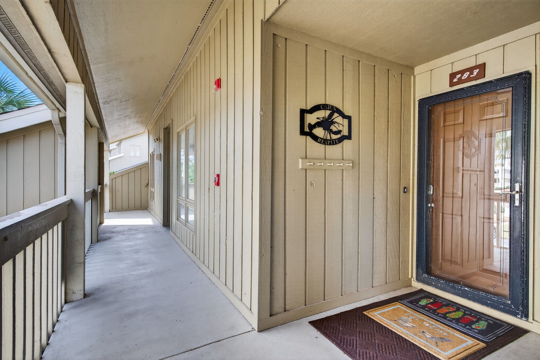 Welcome to Cajun Respite! You'll find your private entrance along this peaceful covered walkway, with your own decorated doorway ready to greet you.