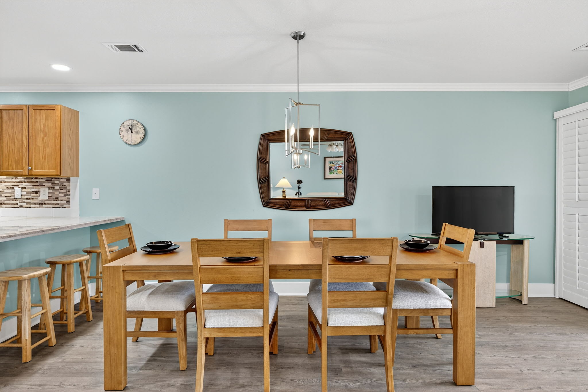 Gather around your spacious dining table for memorable meals, with modern kitchen amenities just steps away and entertainment ready for cozy evenings.