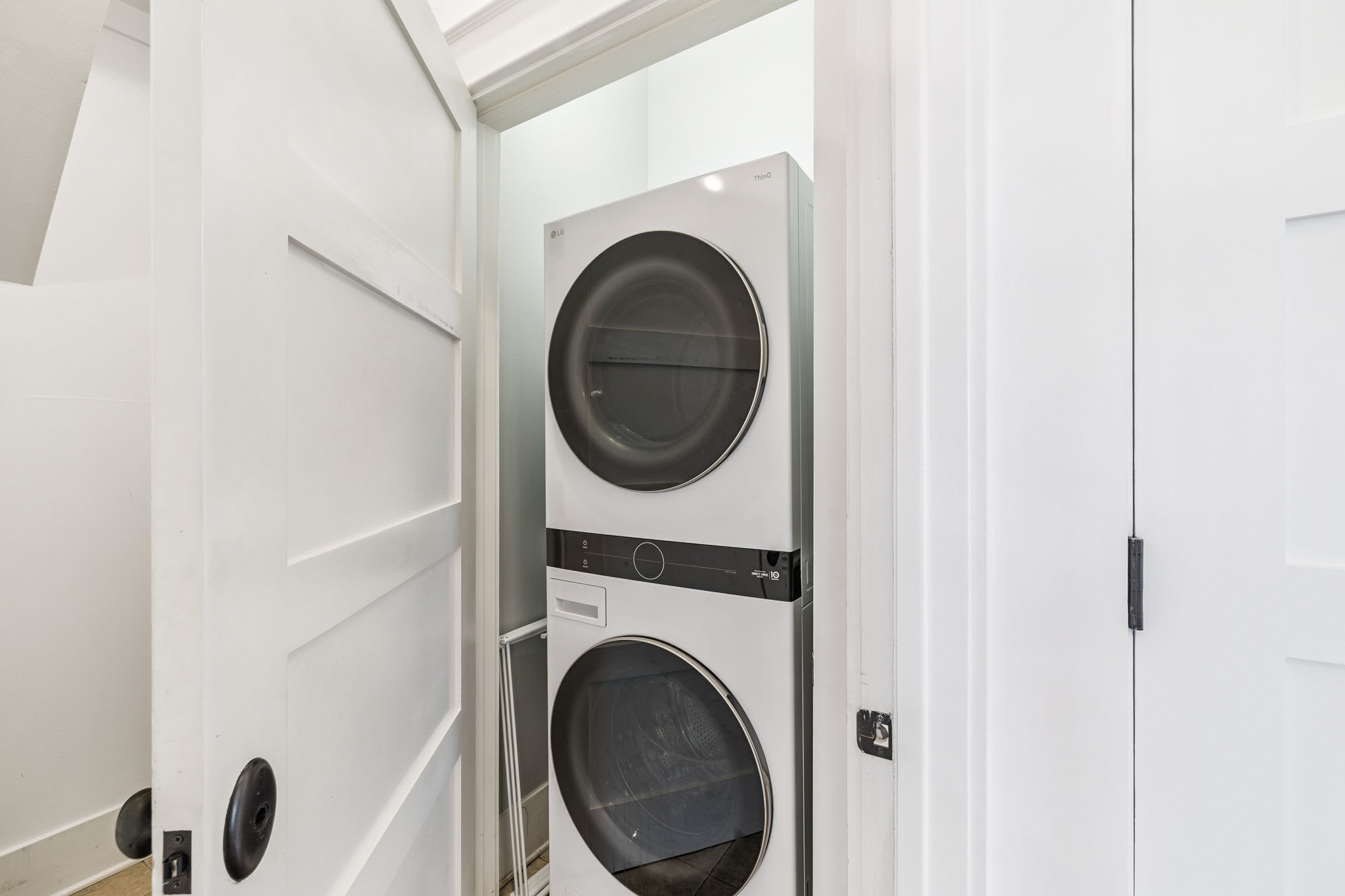 Stack Washer & Dryer Located in the Laundry Area
