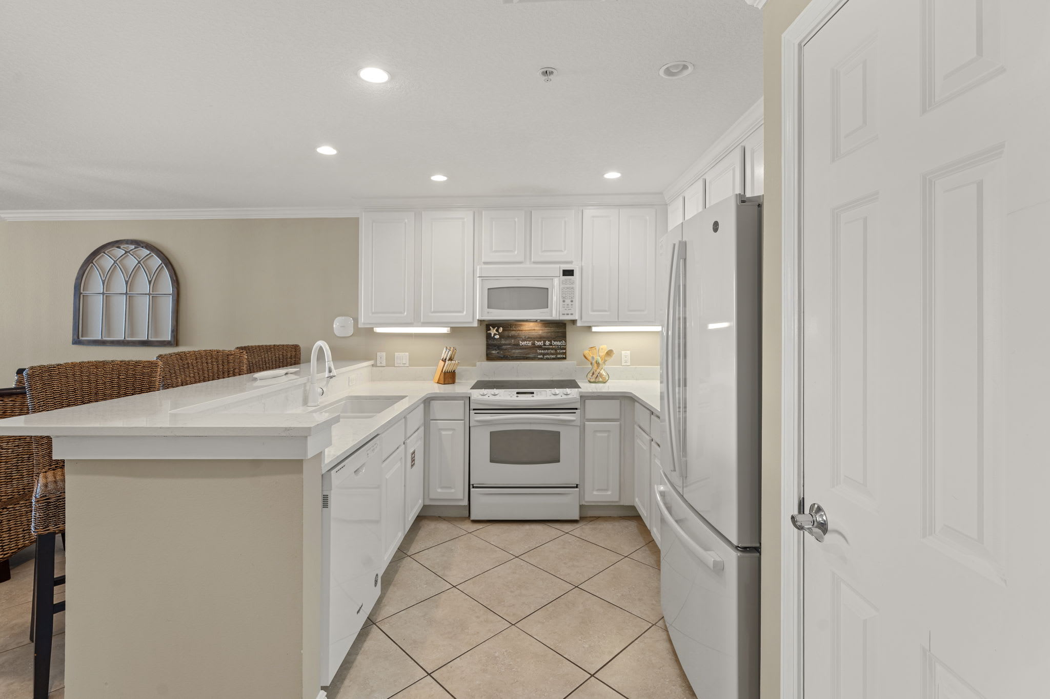 Cook your favorite meals in this bright, fully-equipped kitchen with modern appliances and plenty of counter space for prep work.