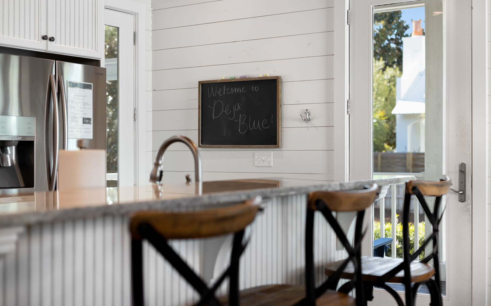 Your bright kitchen welcomes you with modern appliances, granite counters, and charming farmhouse touches for comfortable meal prep.