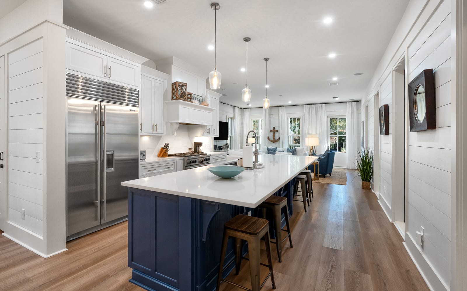 Your gourmet kitchen features marble countertops, stainless steel appliances, and a spacious island perfect for cooking memorable meals together.