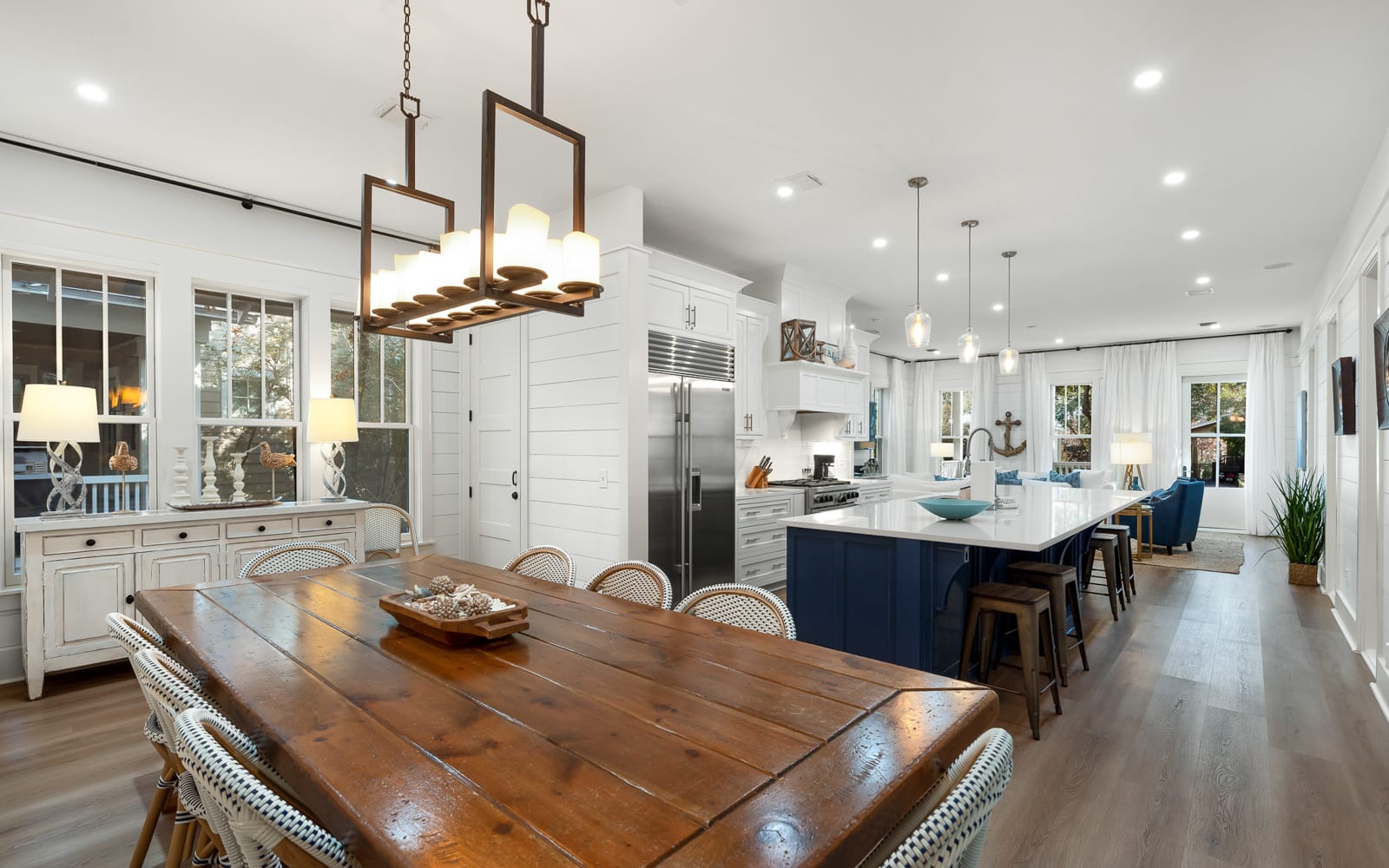 Your open-concept kitchen and dining space creates perfect memories around the rustic farmhouse table while you cook together.