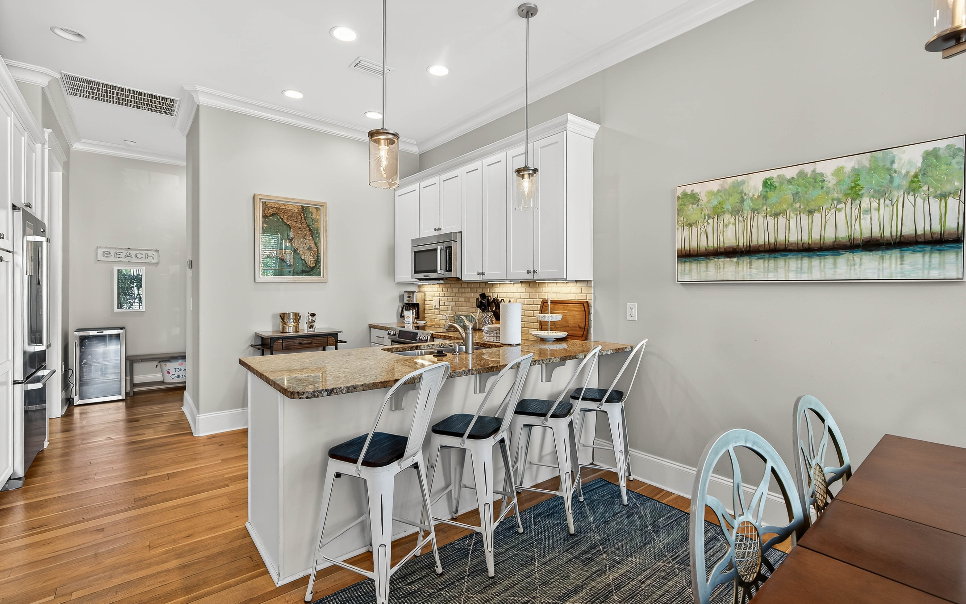 You'll love cooking in this bright, fully-equipped kitchen with granite countertops, modern appliances, and stylish breakfast bar seating.