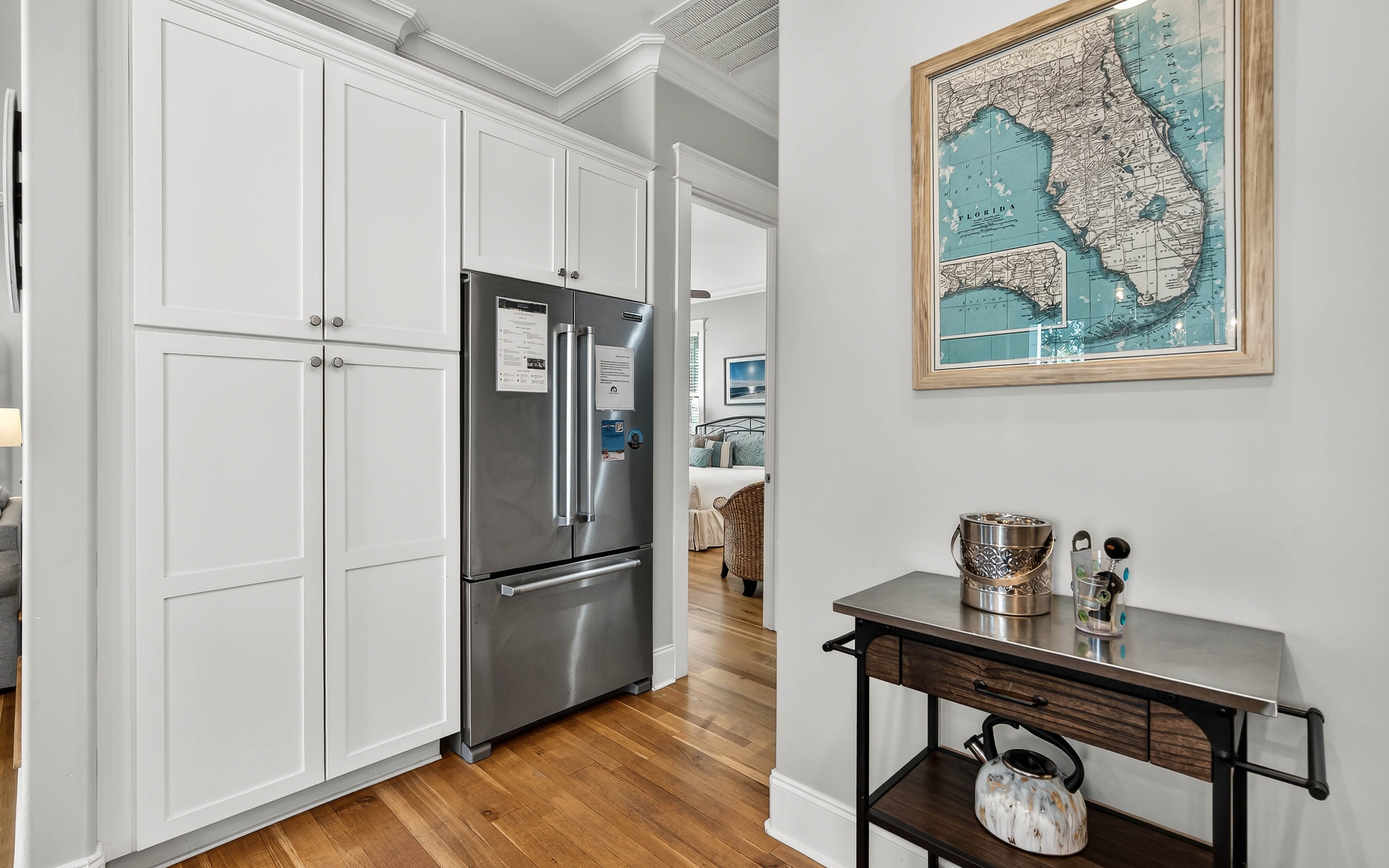 Your kitchen features sleek stainless steel appliances and ample white cabinetry, perfect for preparing memorable meals during your stay.