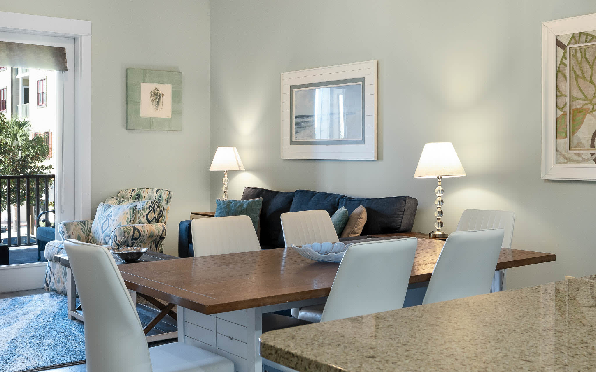 Gather around your elegant dining table for memorable meals, with comfortable seating and warm lighting creating the perfect atmosphere for your stay.