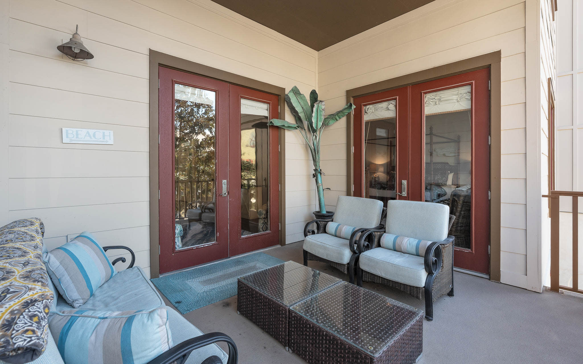 Step onto your private patio where coastal-style seating invites you to unwind with morning coffee or evening conversations in complete comfort.