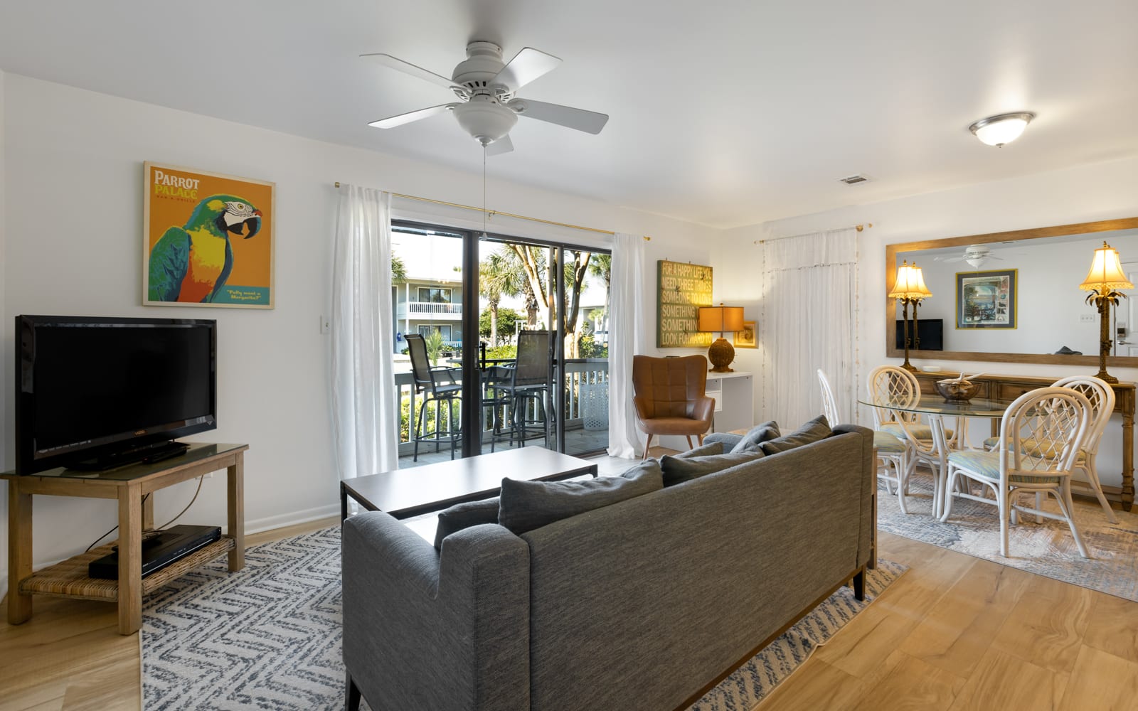 Relax in your bright, open living space with a cozy sofa facing the TV, while the dining area and balcony beckon for memorable moments together.