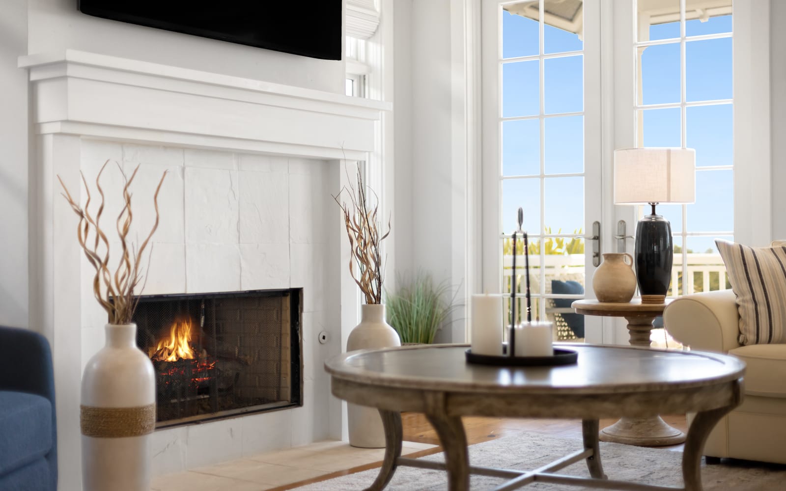 Relax by your crackling fireplace with French doors opening to scenic views, creating the perfect atmosphere for cozy evenings.