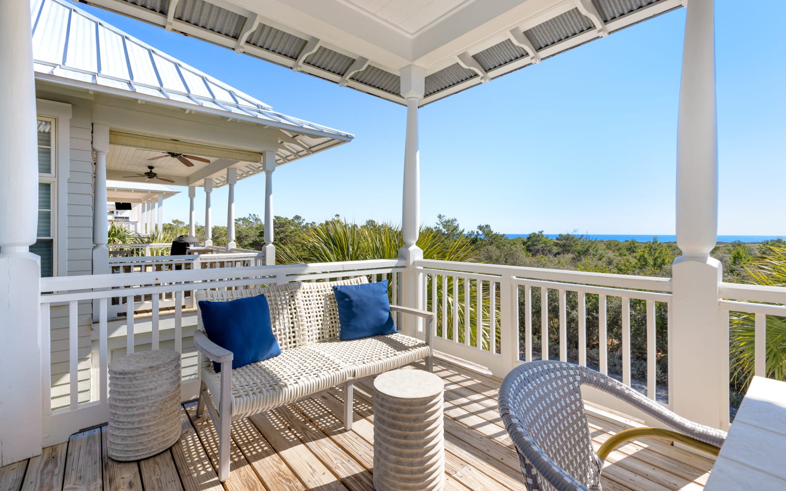 Relax on your private balcony with gulf views, where comfortable seating and coastal breezes create the perfect spot to unwind.
