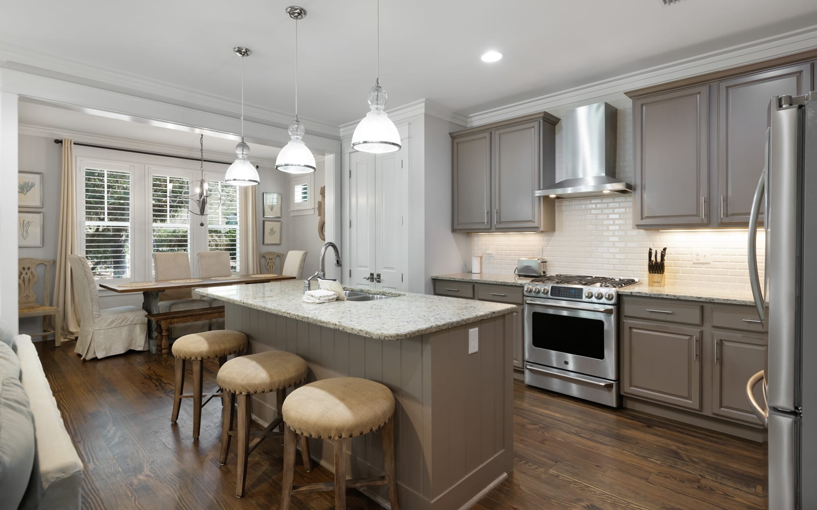 Your gourmet kitchen features granite countertops, stainless steel appliances, and a breakfast bar where you can savor morning coffee.