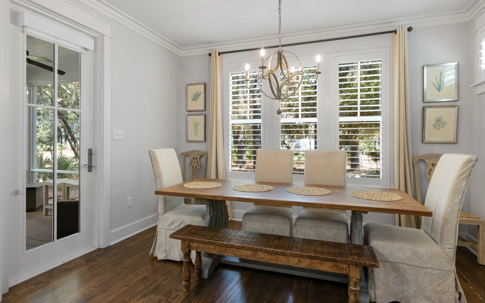 Gather around your elegant dining table where morning coffee and evening conversations flow naturally in this beautifully appointed space.